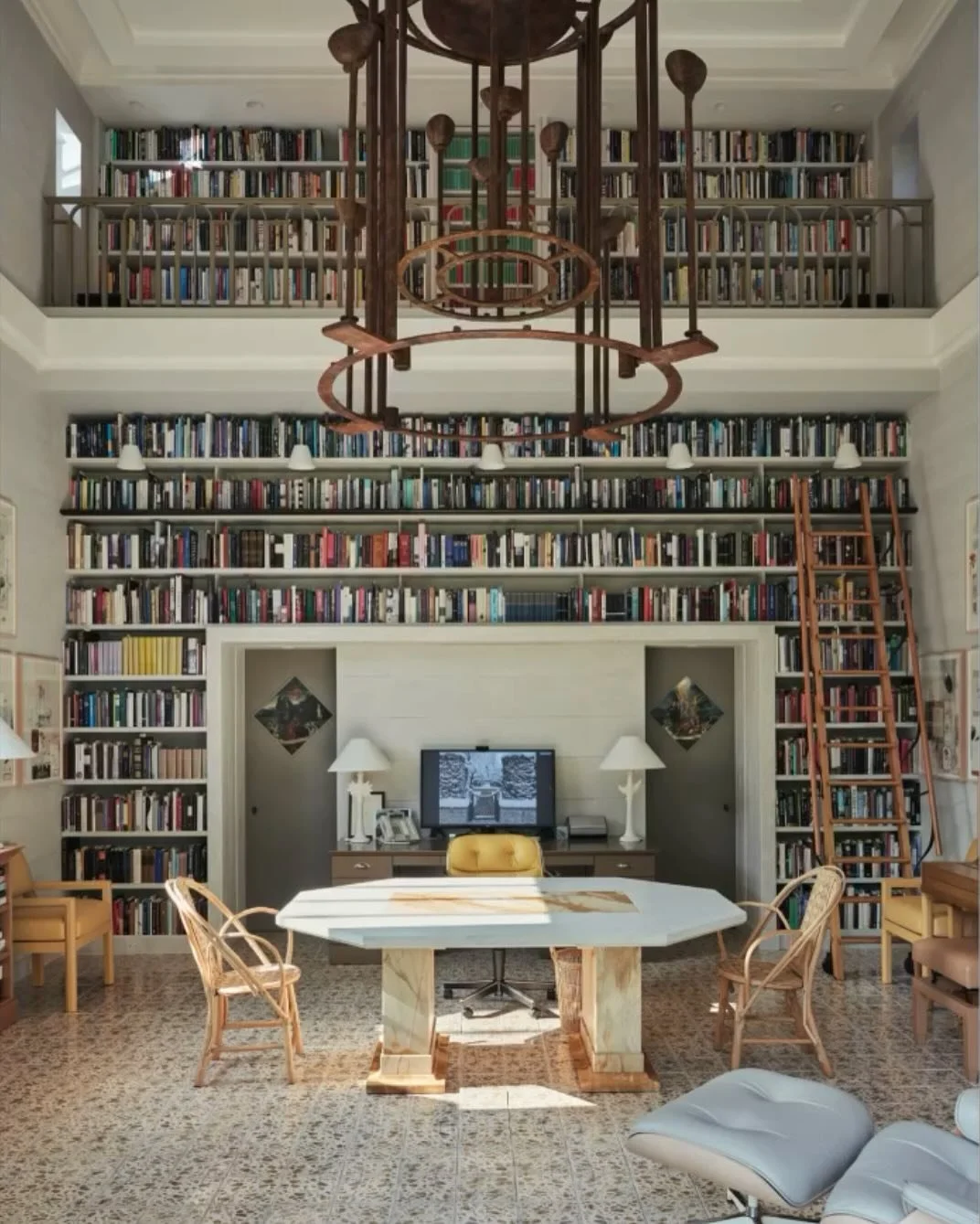 I&rsquo;ve always been fascinated by Wunderkammer&rsquo;s or Cabinets of Curiosity - rooms of wonder with an undifferentiated mix of art, science, and literature. 

The interior walls of this office are covered in books. It is a library of human thou