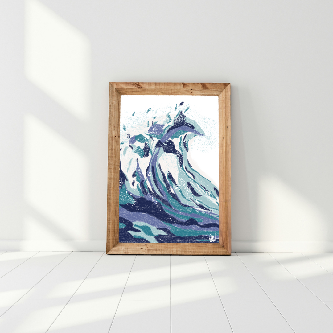 Digital art of large ocean waves, framed in wood, leaning against a white wall.