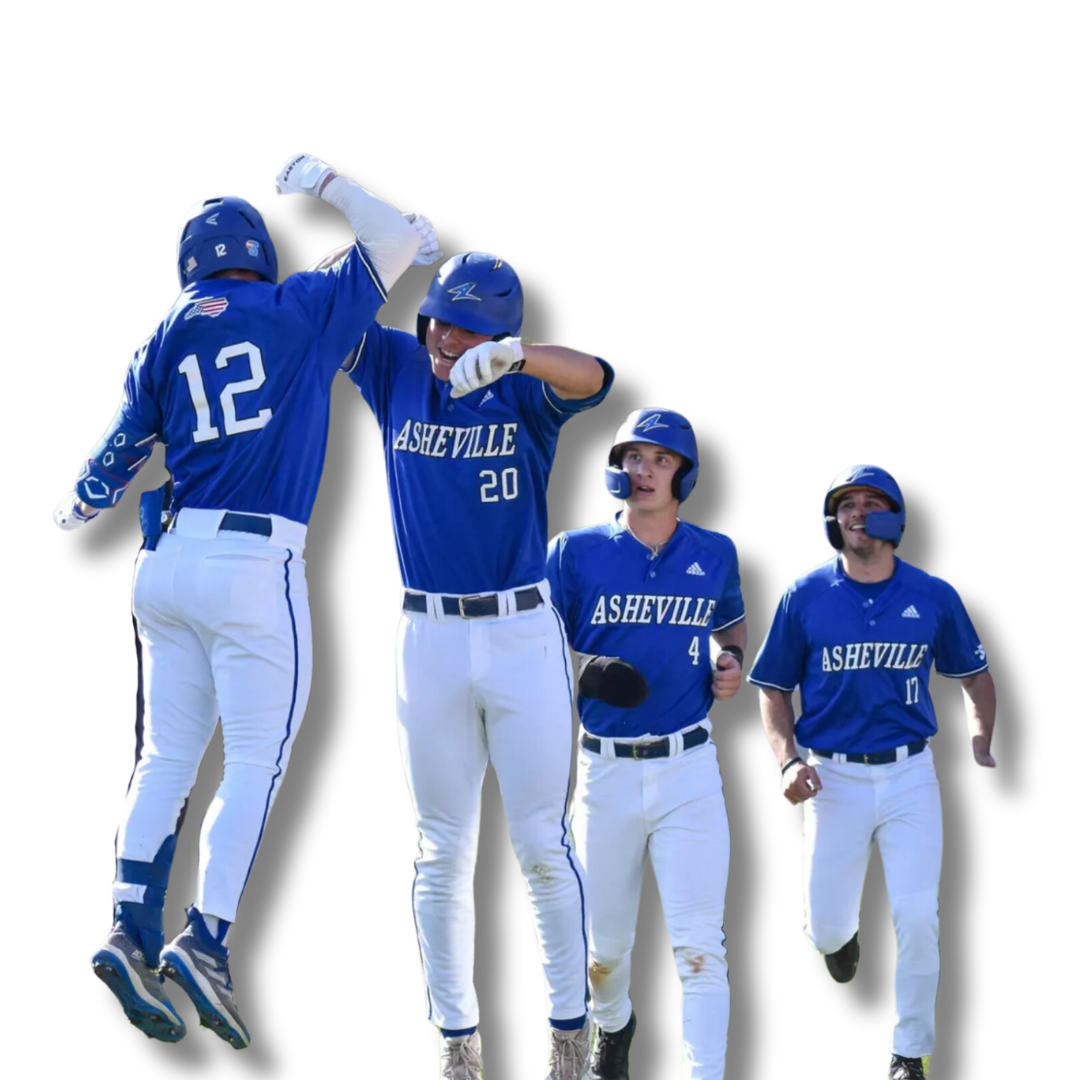 Four baseball players in blue jerseys with 'ASHEVILLE' written on them, celebrating a play. Two players are jumping, while the other two are walking.