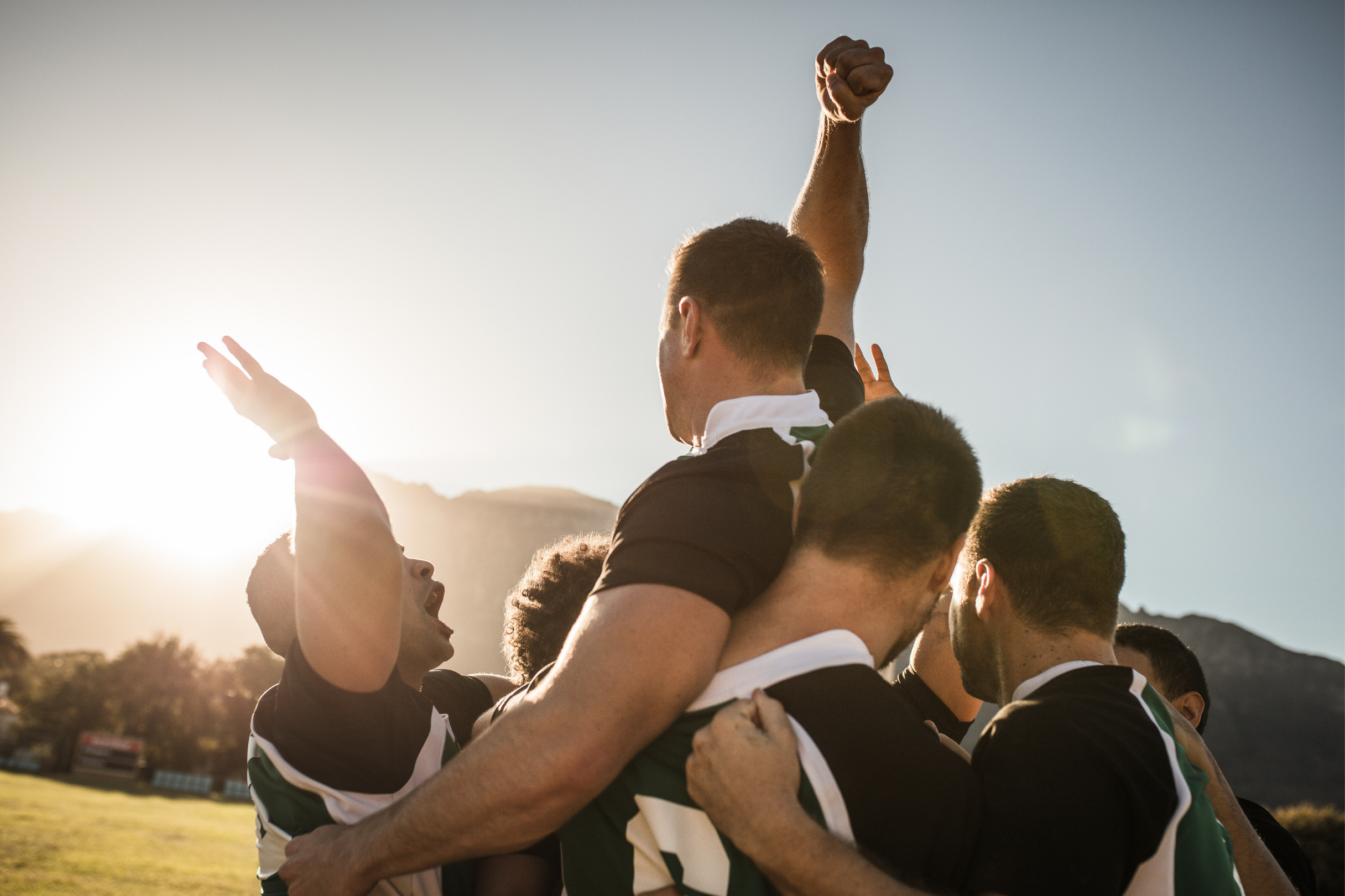 Image of soccer team celebrating a goal together