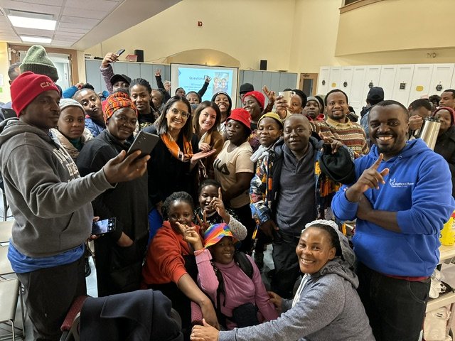 A large group of people smiling at the camera