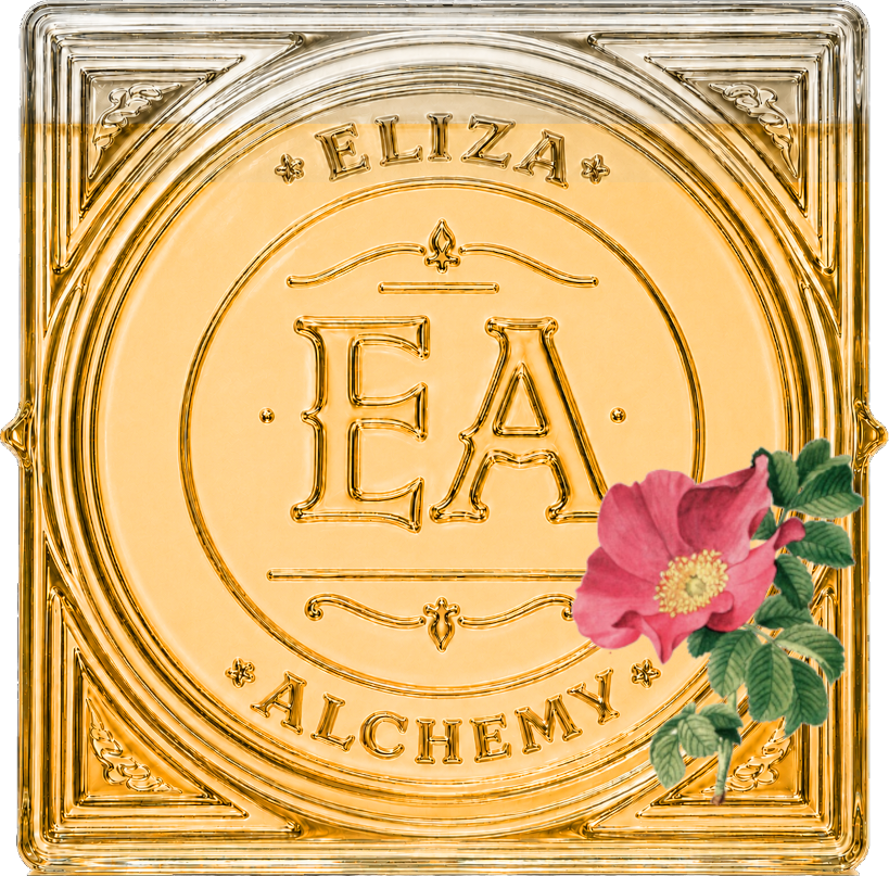 A decorative gold-colored tile with intricate borders, the initials 'E A' in the center, the words 'ELIZA' at the top, and 'ALCHEMY' at the bottom, featuring a pink flower with green leaves in the bottom right corner.