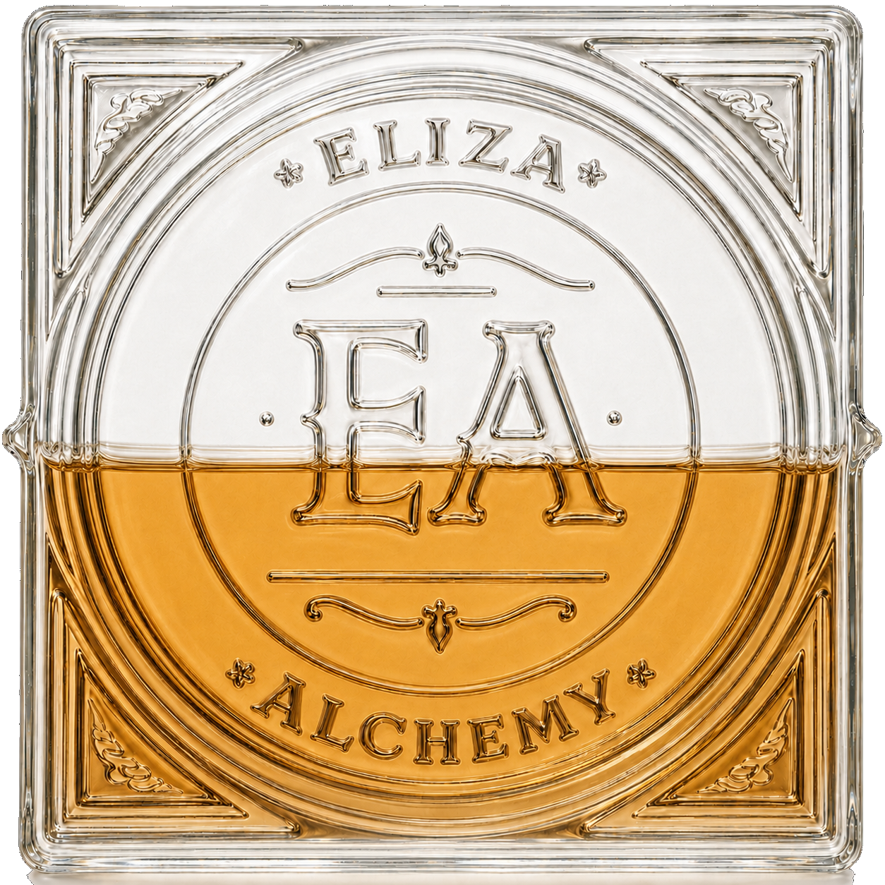 A transparent glass block with an embossed design of the word 'BEA,' the words 'ELIZIA' and 'ALCHEMY,' and decorative elements, half-filled with amber-colored liquid.