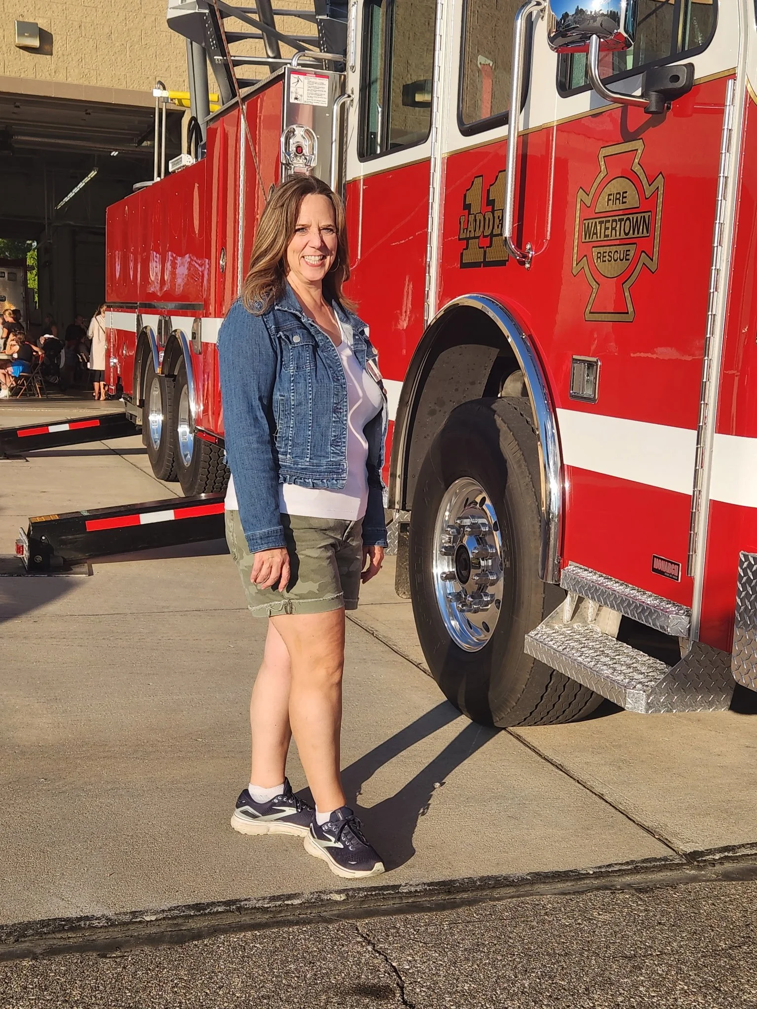 Deborah Everson standing by a fire truck at the Watertown Fire Department open house.