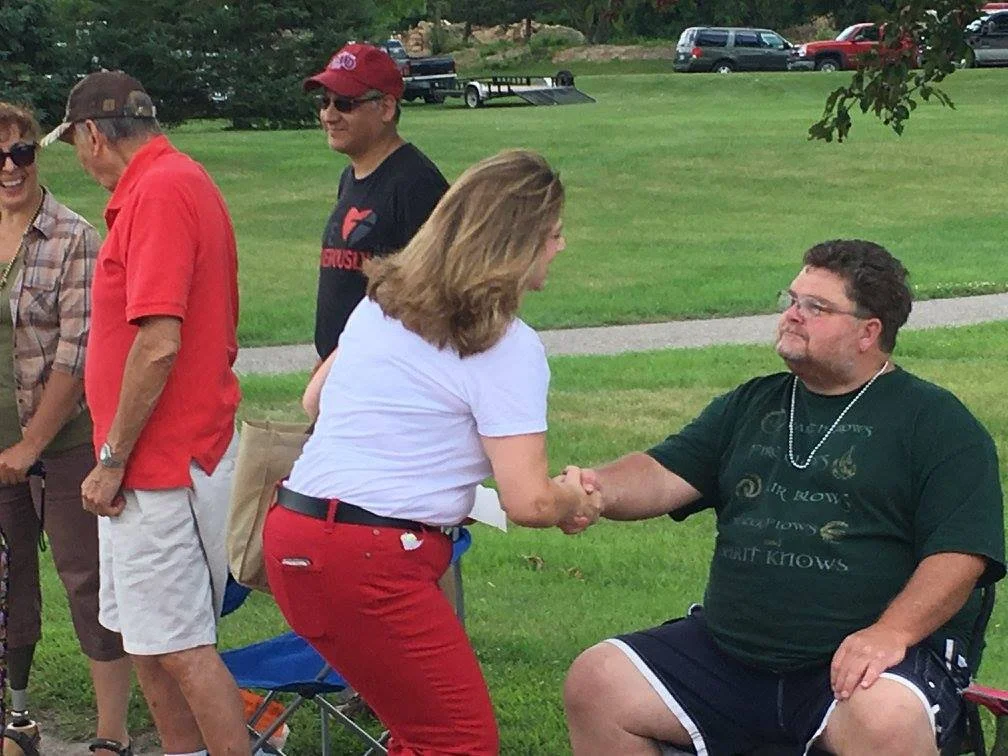 Deborah Everson greeting a constituent at the Rails-to-Trails parade.