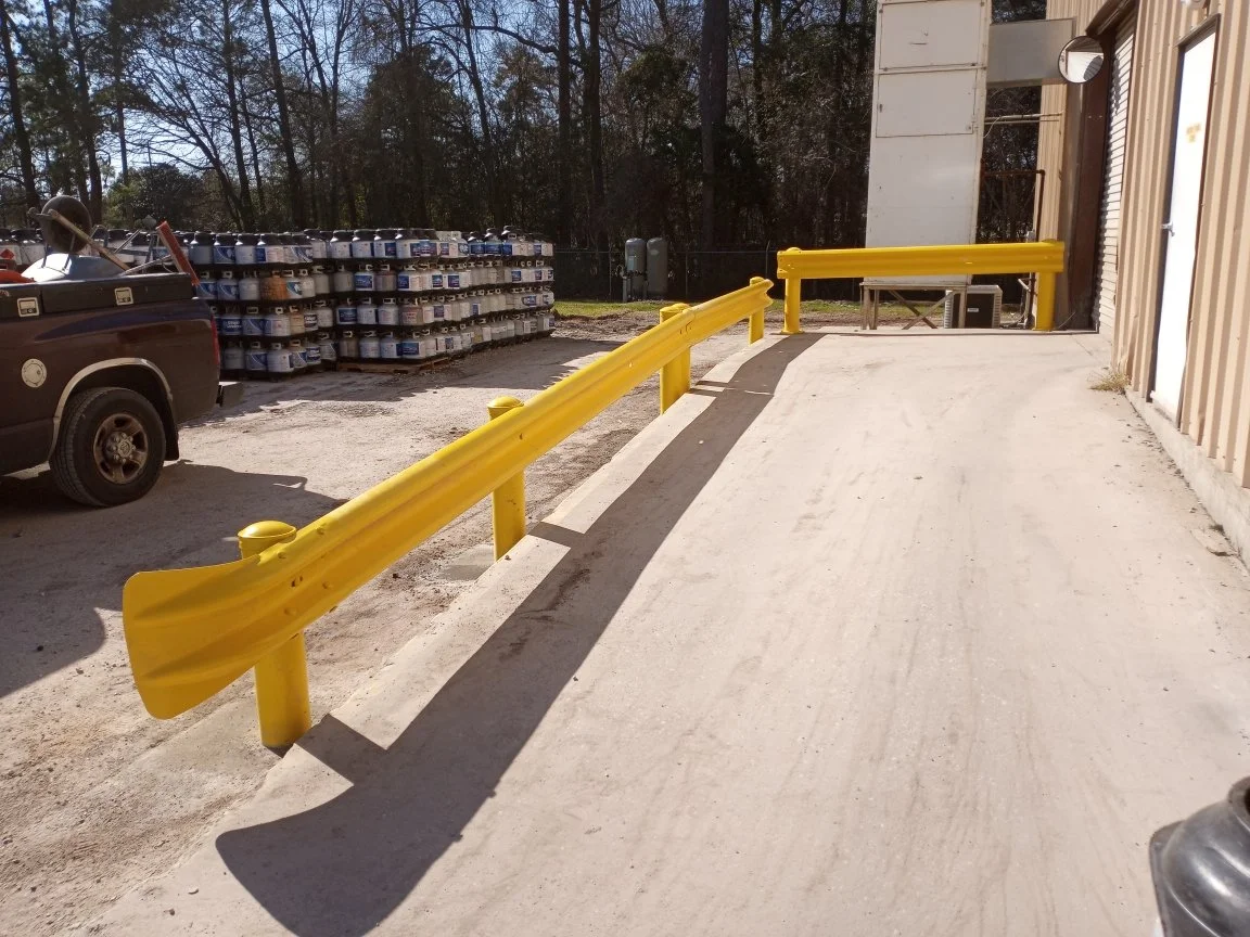 Guard rails used to prevent traffic from driving off ramp.