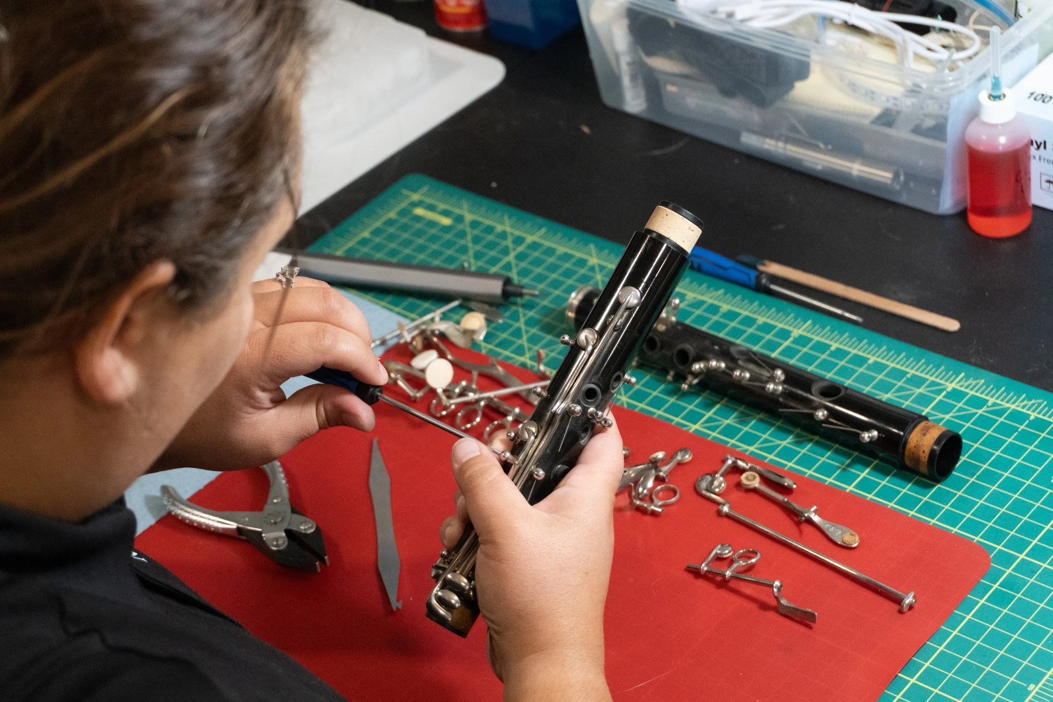 Close up of a clarinet's keys being removed.
