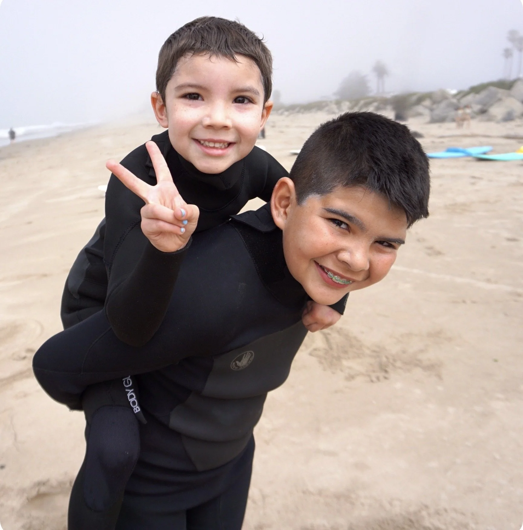 Two young boys posing at beach