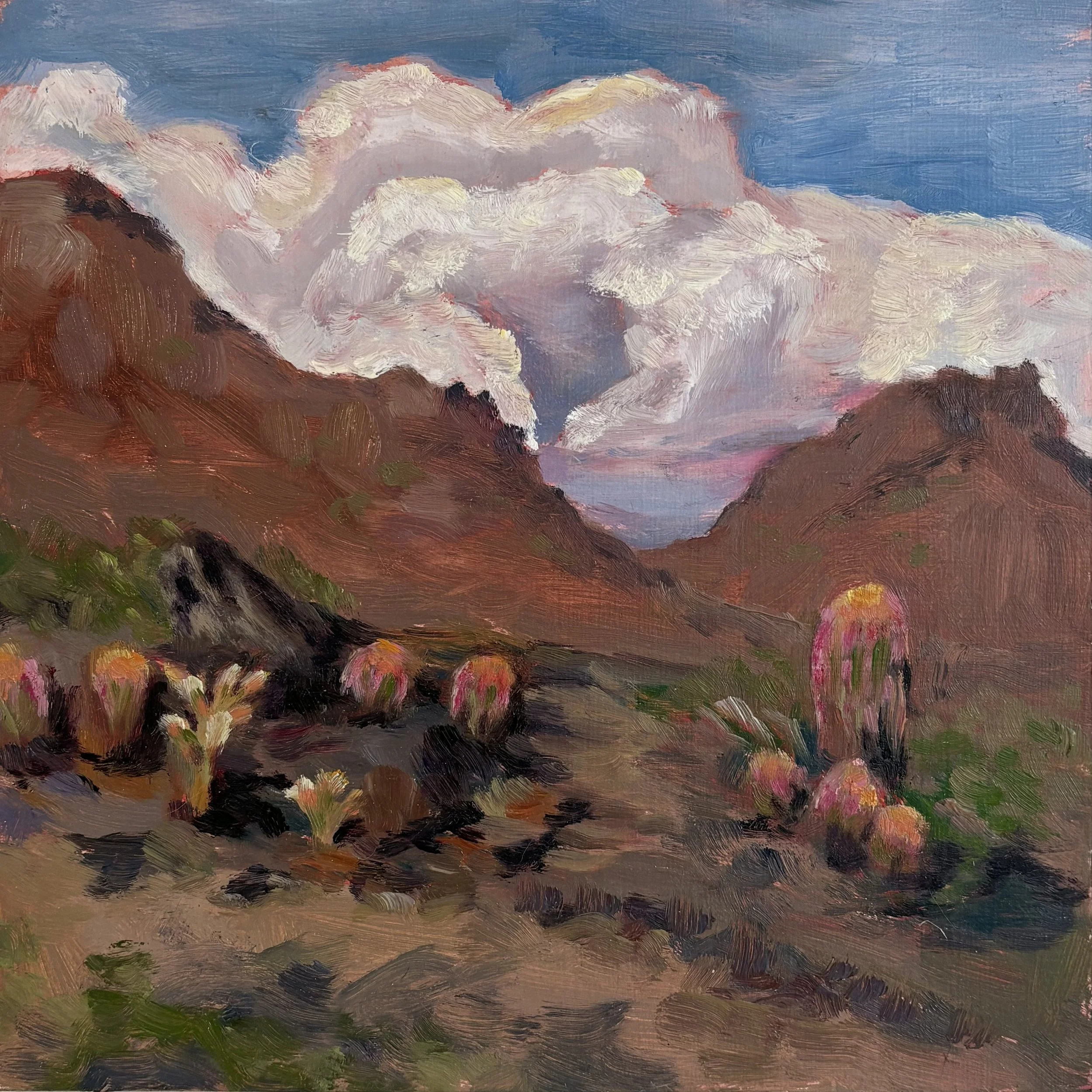 Brown desert landscape painting with pink and white puffy clouds with blue skies in the background