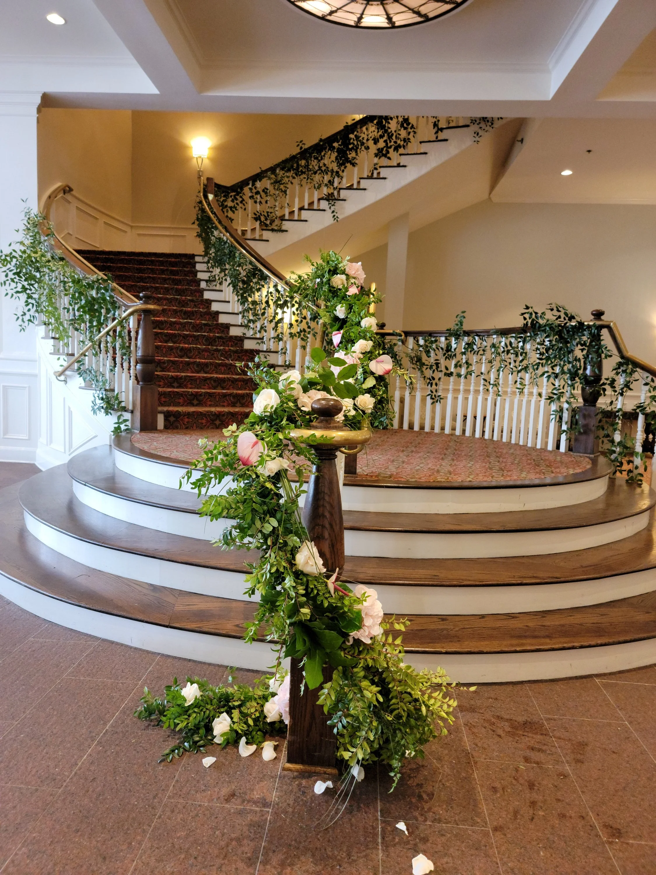 Wedding Florist stairs decorated with flowers.jpg
