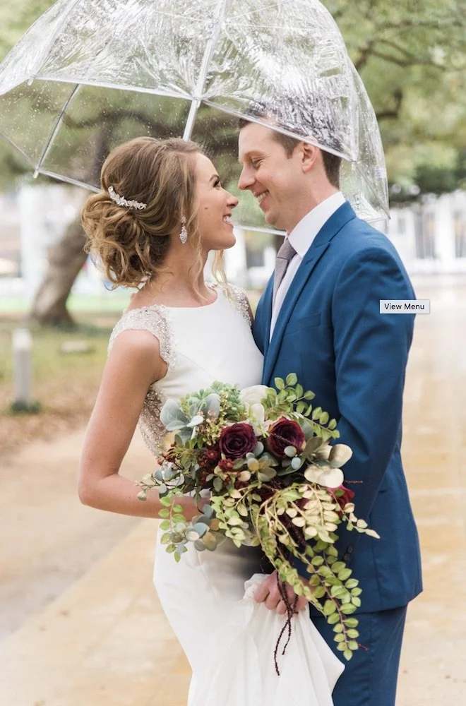 Wedding Couple with Bouquet by Kathy Reynolds Wedding Florist.jpg