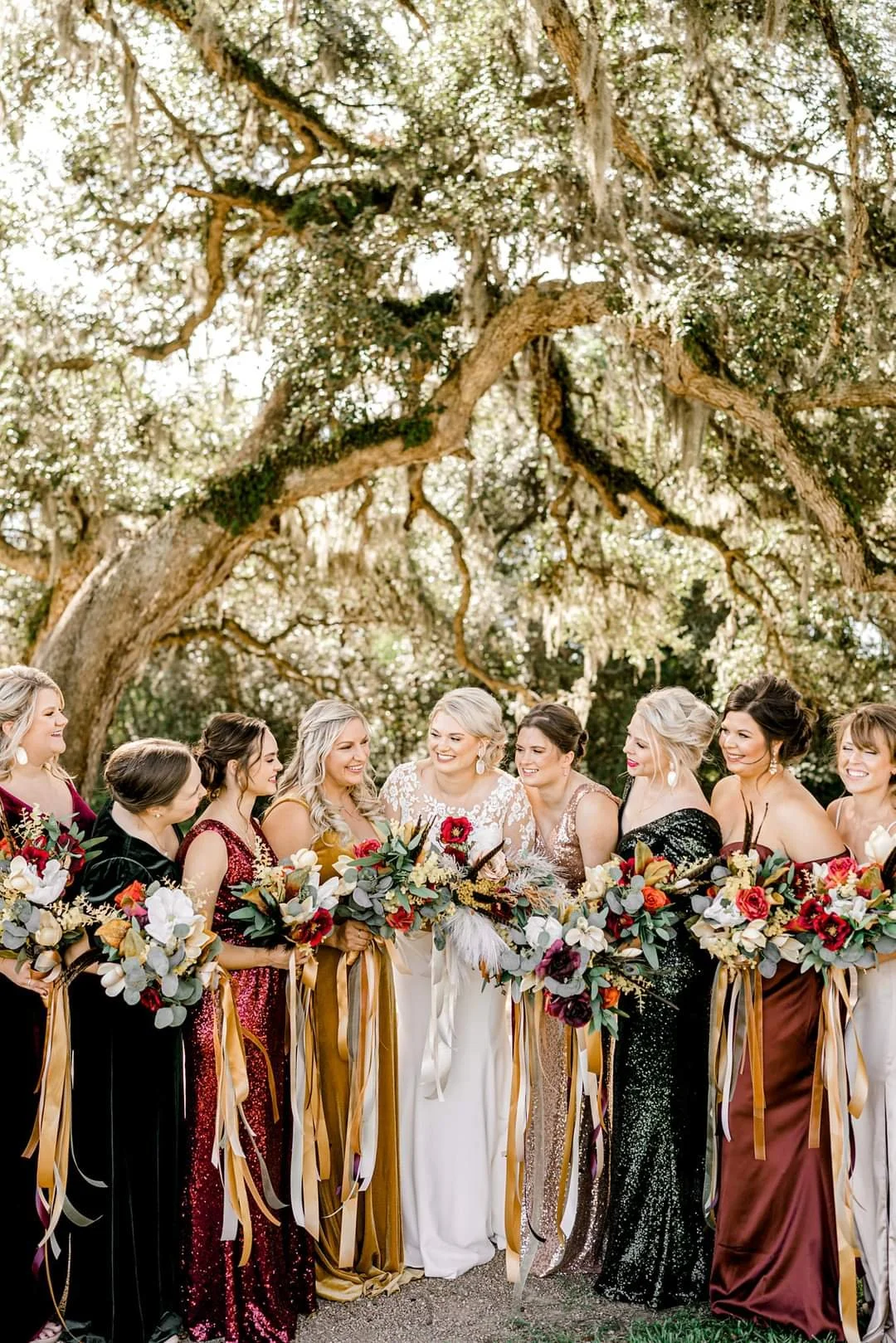 Bridal Party under trees with bouquets by Kathy Reynolds Wedding Florist.jpg