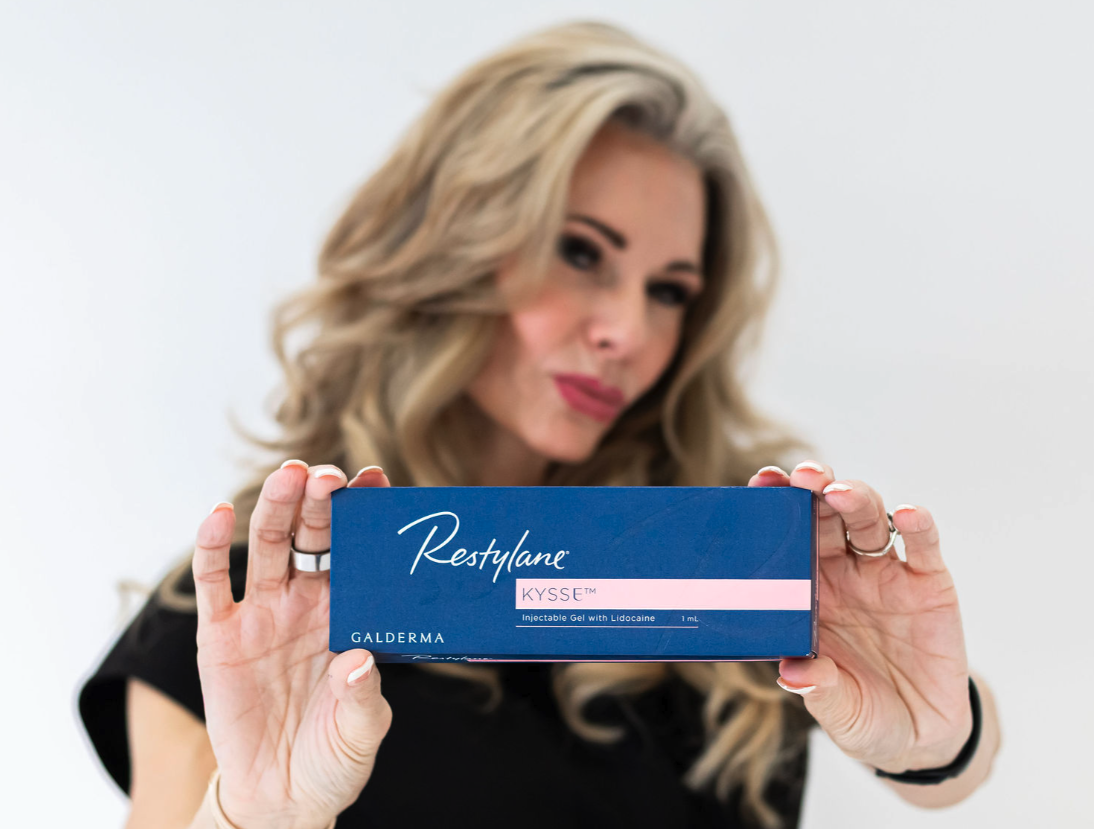 Aesthetic injector holding Restylane Kisse filler