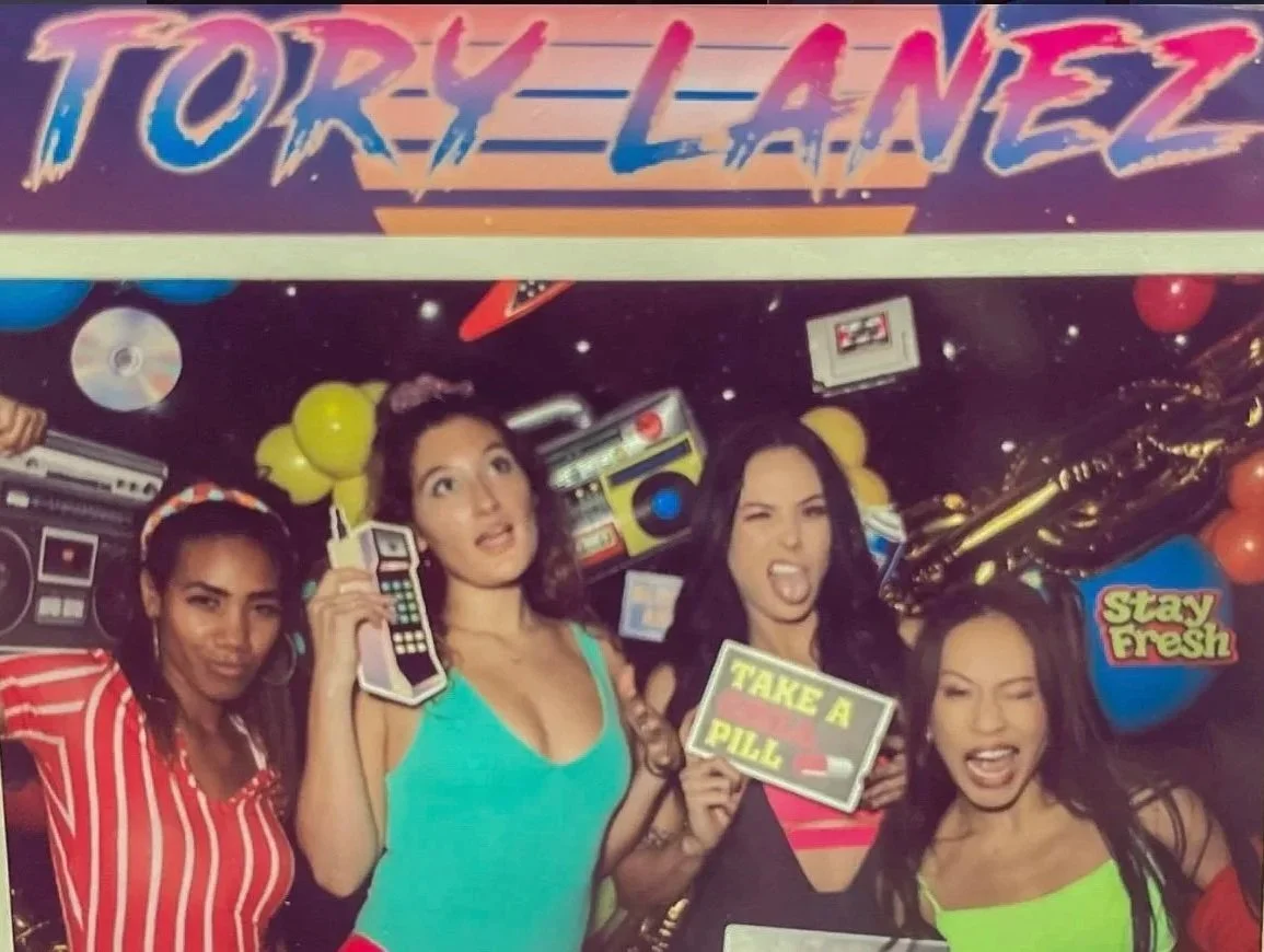 Roller Skaters dressed in retro costumes providing entertainment at a private 80s themed party.