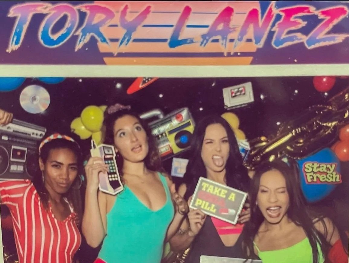 Roller Skaters dressed in retro costumes providing entertainment at a private 80s themed party.