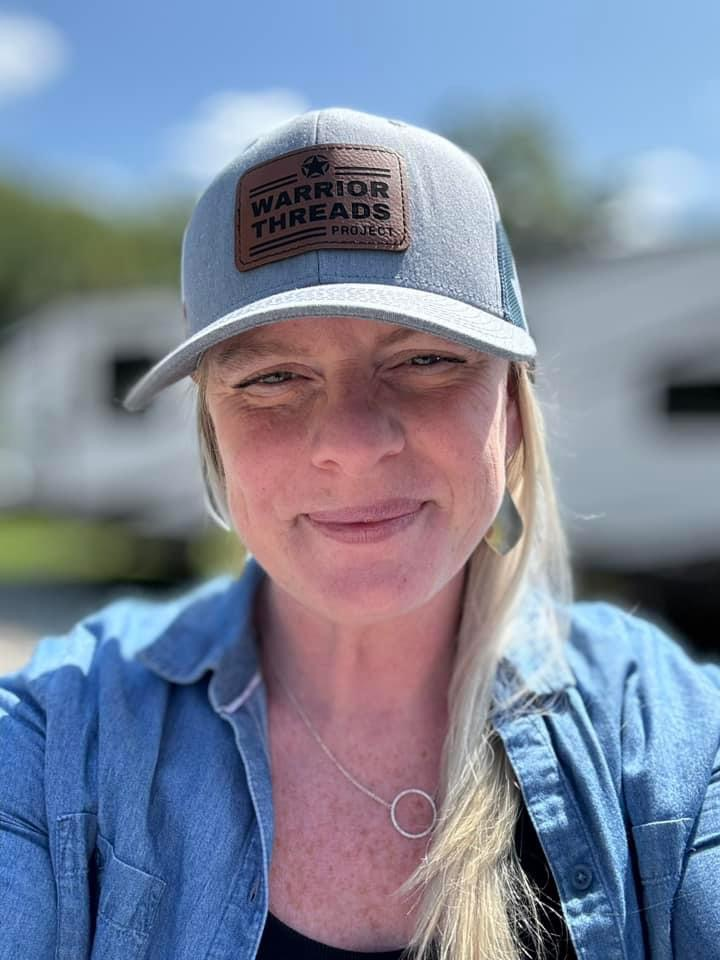 Person wearing Warrior Threads hat