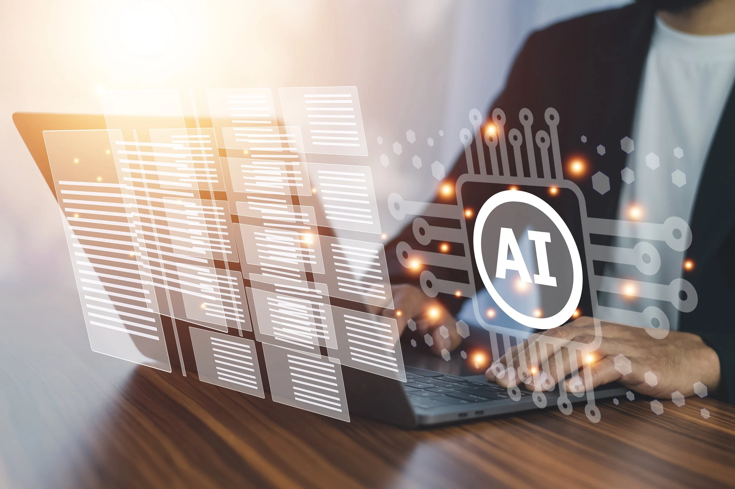 Person working on a laptop with digital holograms of AI, data, and technology icons floating in front.