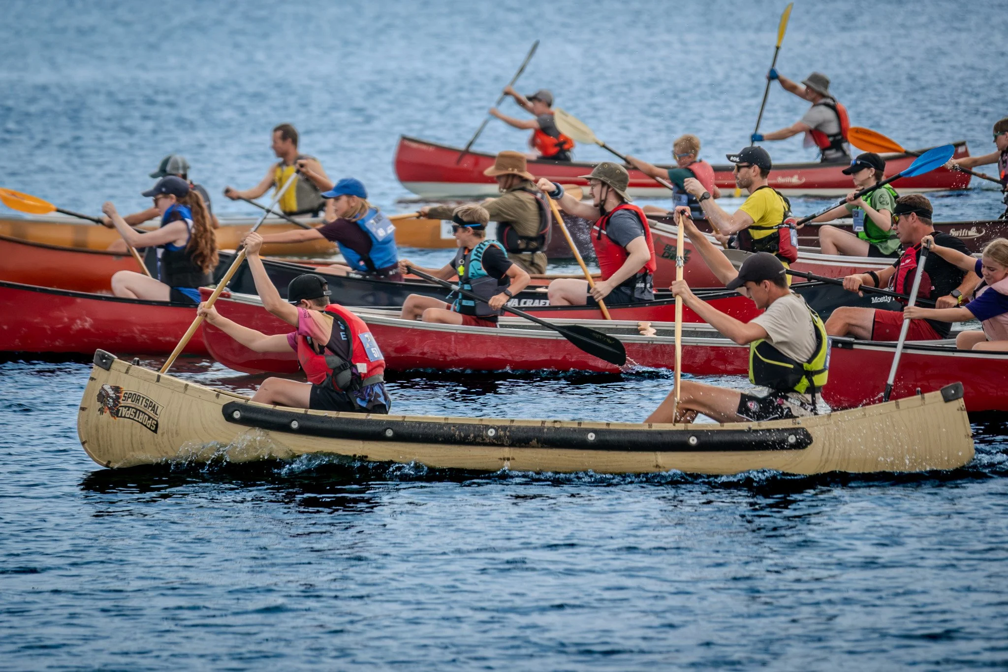 Canoe race mass start on the water