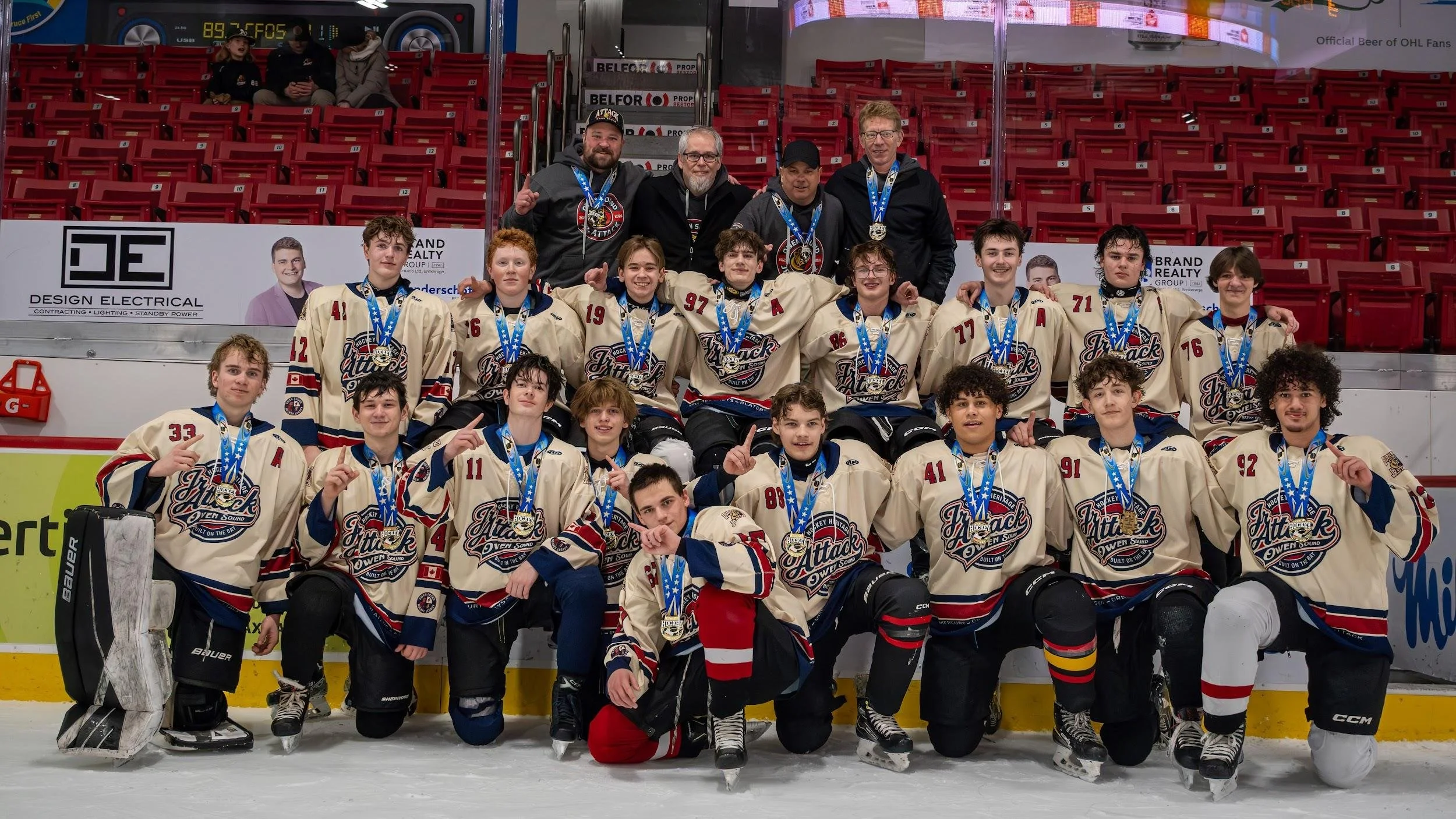Owen Sound Jr. Attack gold medal team celebrating on the ice at Bayshore