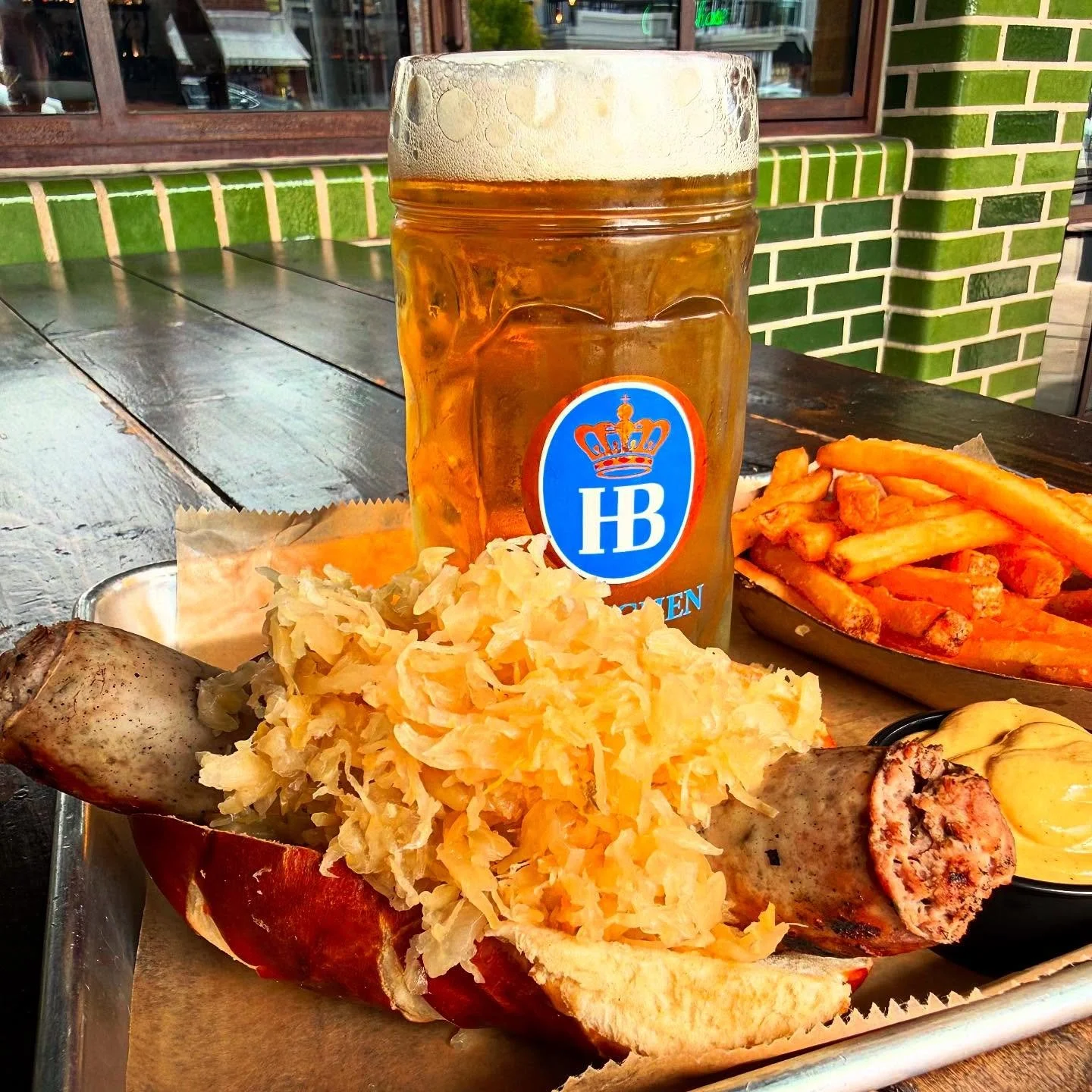 OKTOBERFEST SPECIAL! ๐จ House-Made Boar Bratwurst, Sauerkraut, & Spicy Mustard on a Pretzel Bun. Available all of September! ๐ป ๐ญ ๐ฅจ