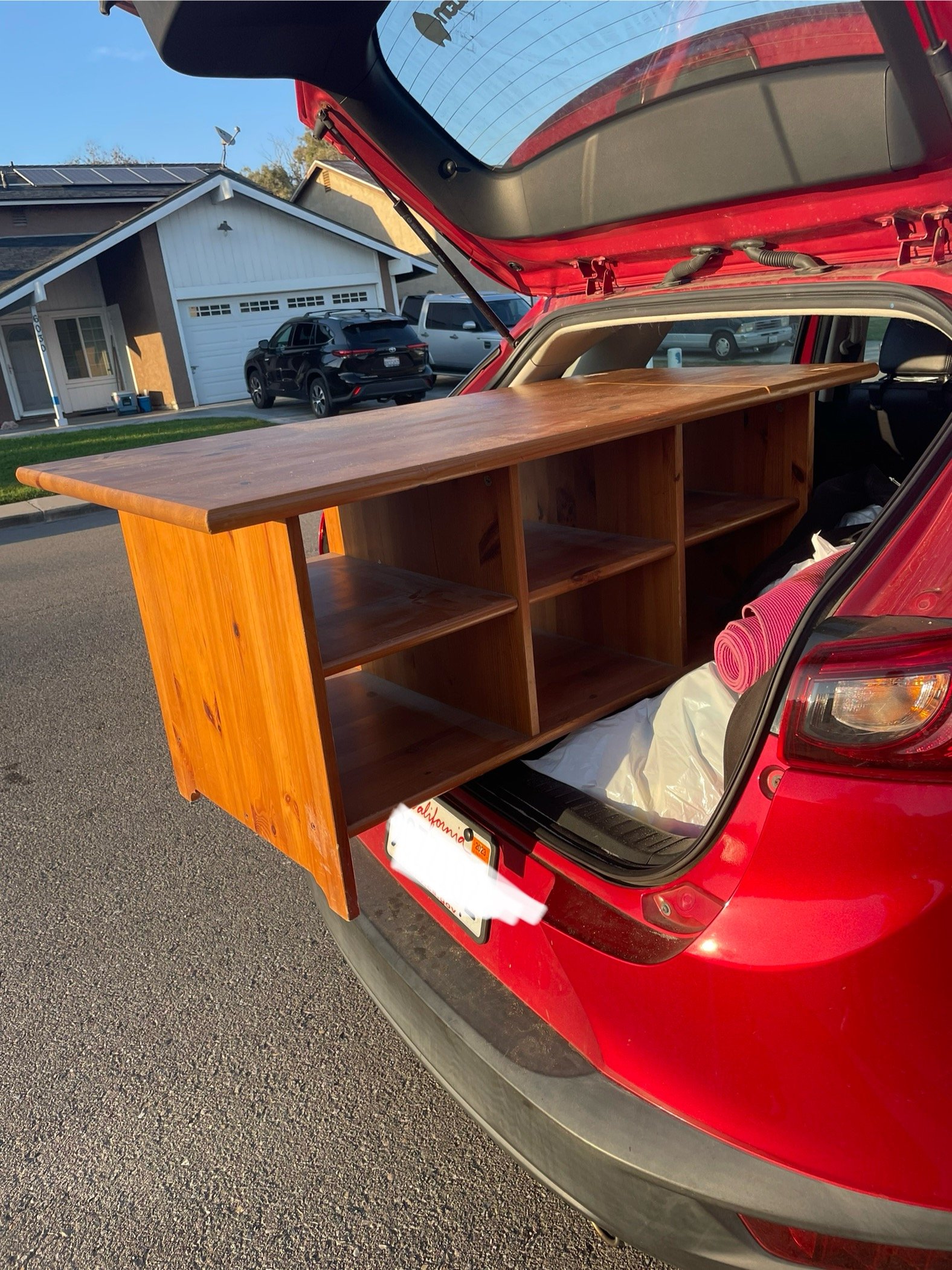 I got majority of my apartment things from garage and rummage sales. Found this amazing table on the side of the road for free! But will it fit in the car??
