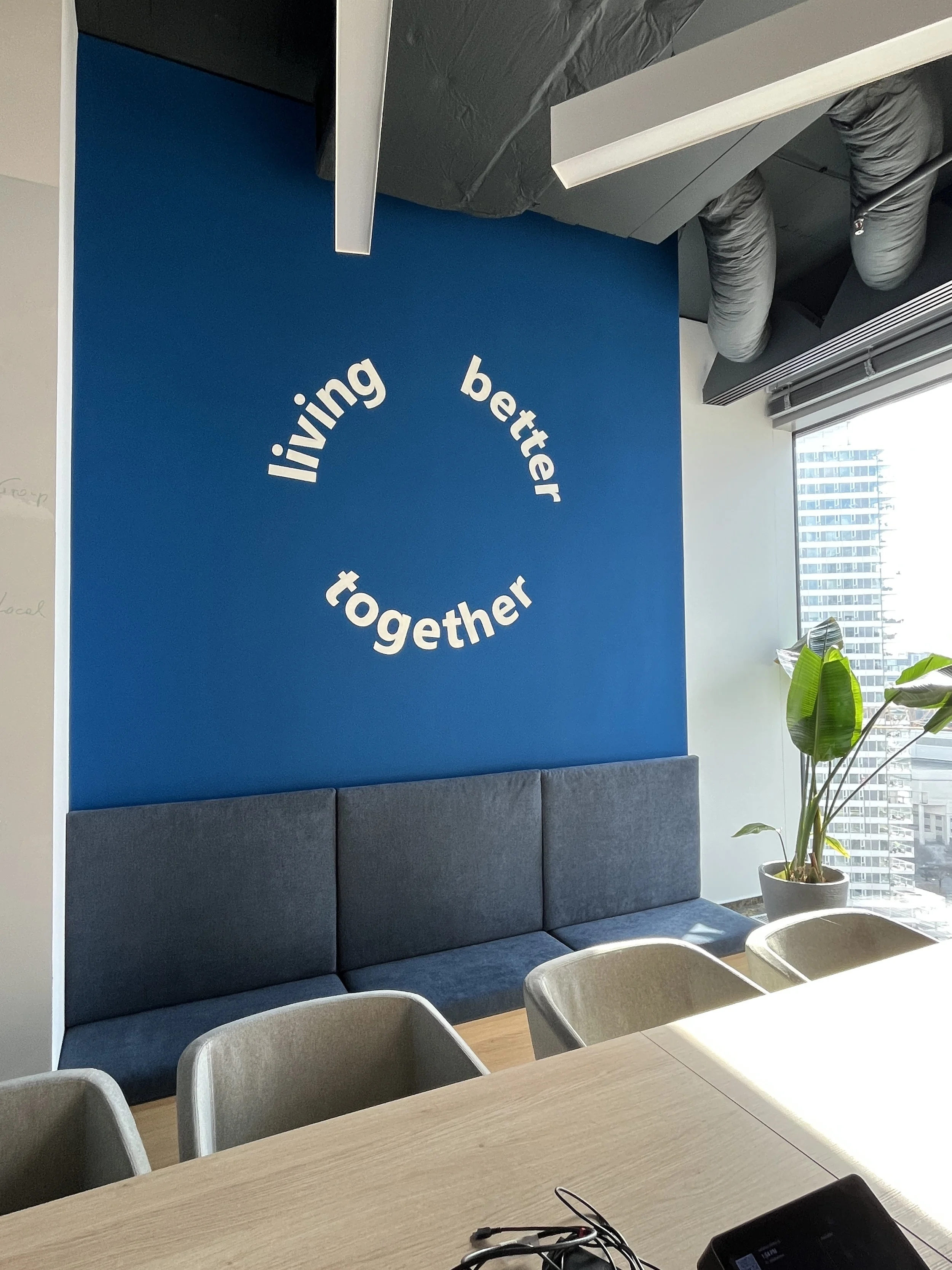 Interior Mural of the UNIQUA Corporate Slogan: ,,living better together".