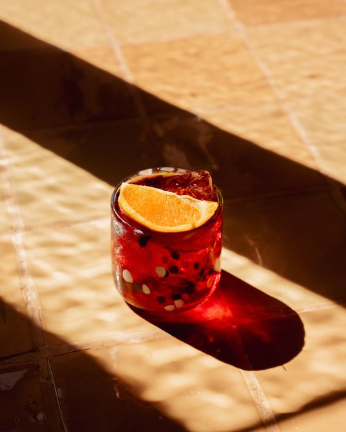 An orange drink in the afternoon sun