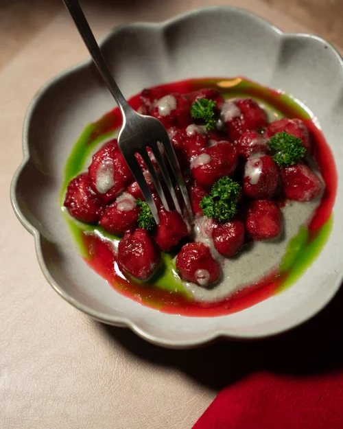 A bright red starter in a scalloped bowl