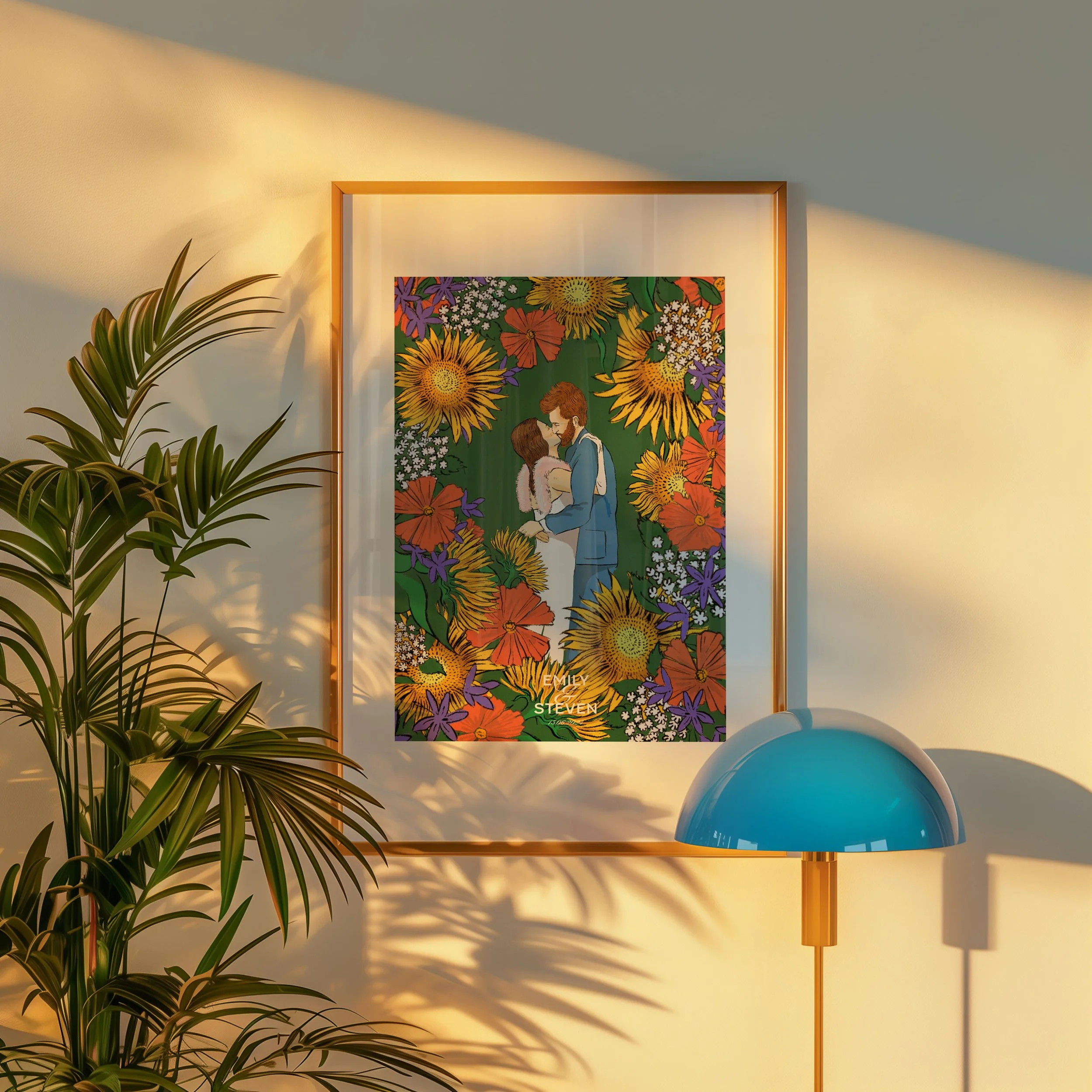 A framed artwork hanging on a wall featuring a man and woman standing close, surrounded by colorful flowers. A blue desk lamp is in front of the artwork, and a potted plant is on the left, casting shadows on the wall.