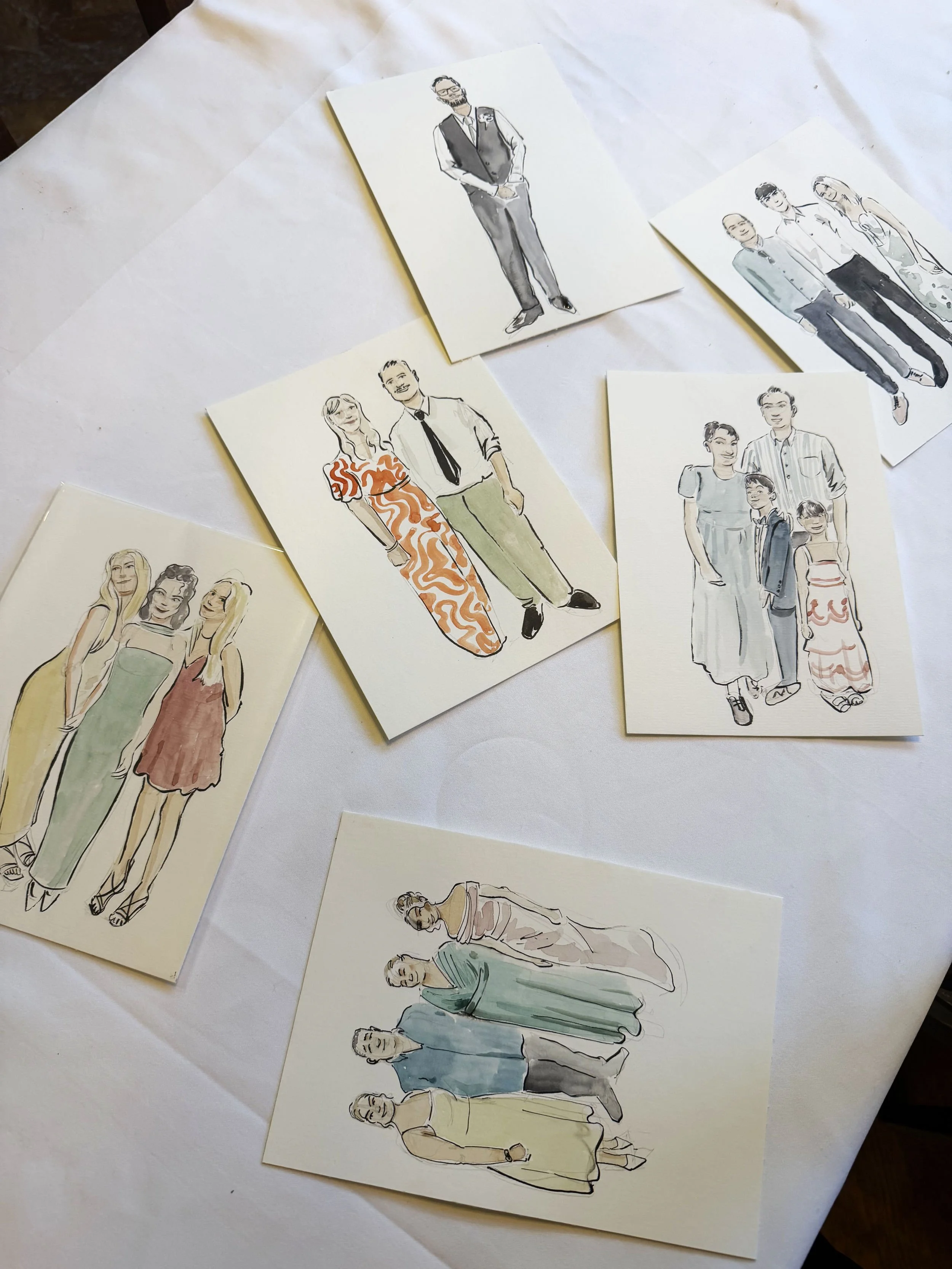 A collection of hand-drawn and painted illustrations of various people, featuring different genders and styles, arranged on a white surface.