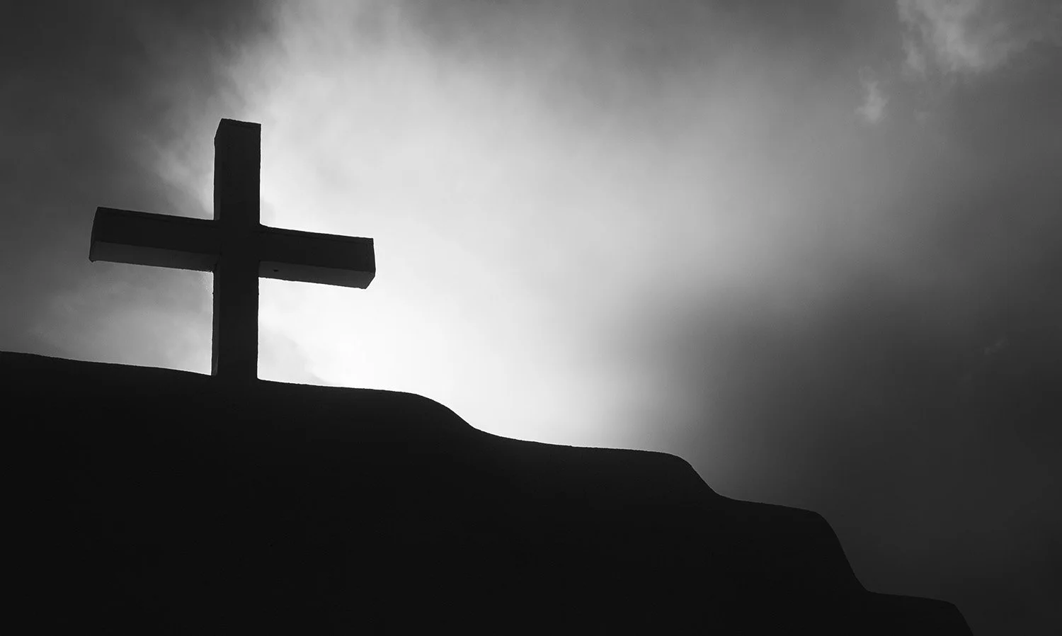 Wooden Cross on an Adobe Arch