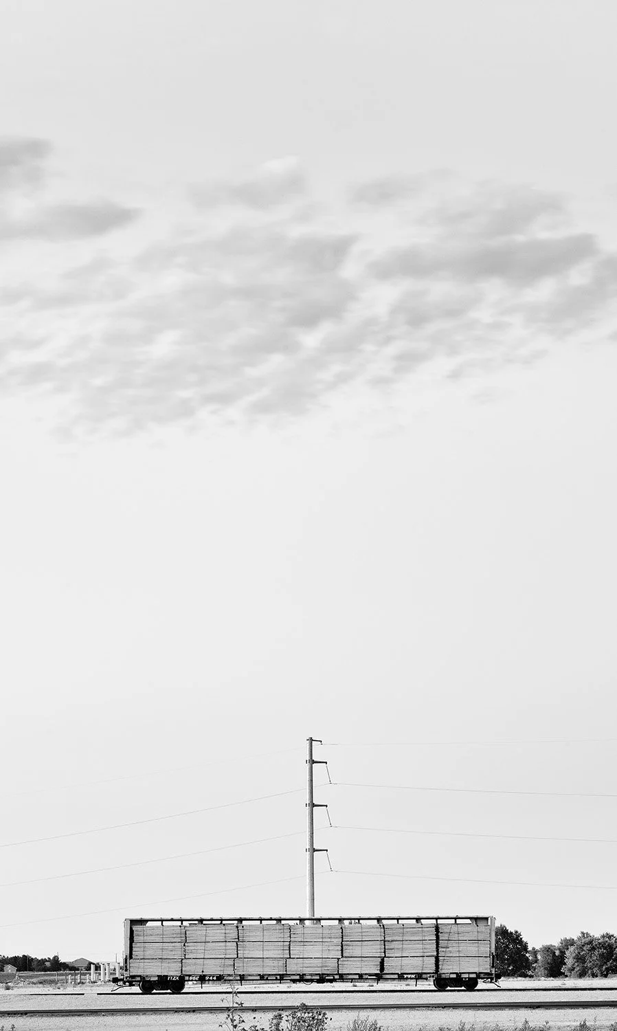 Car, Power Lines, and Clouds