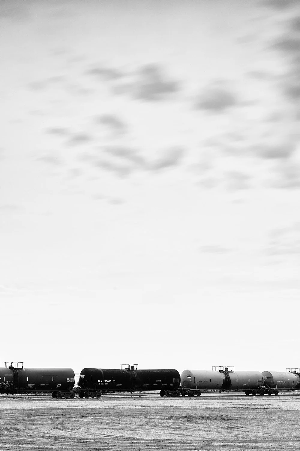 Four Tank Cars and Clouds
