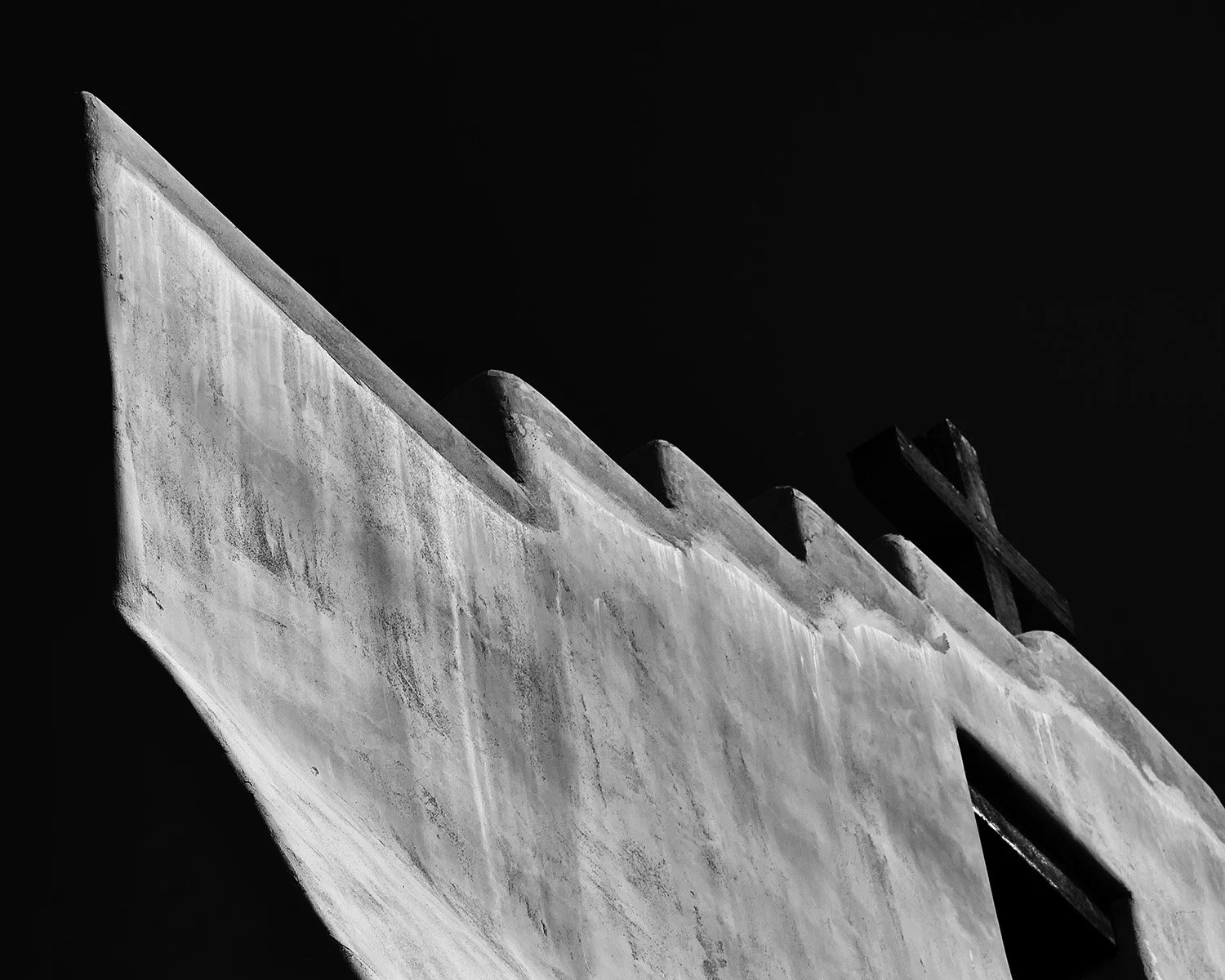 Adobe Facade and Wooden Cross