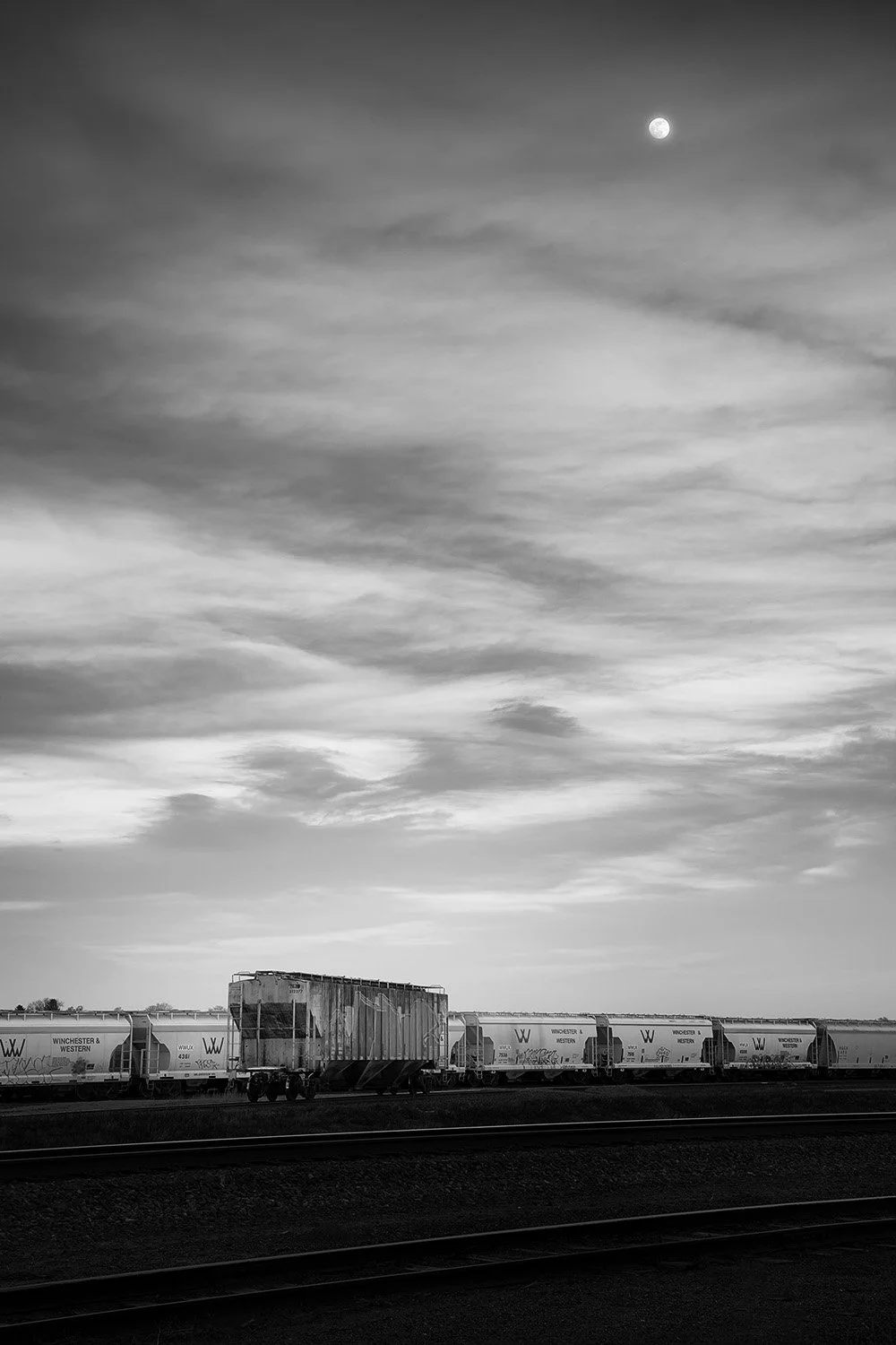 Moon, Clouds, and Eight Cars