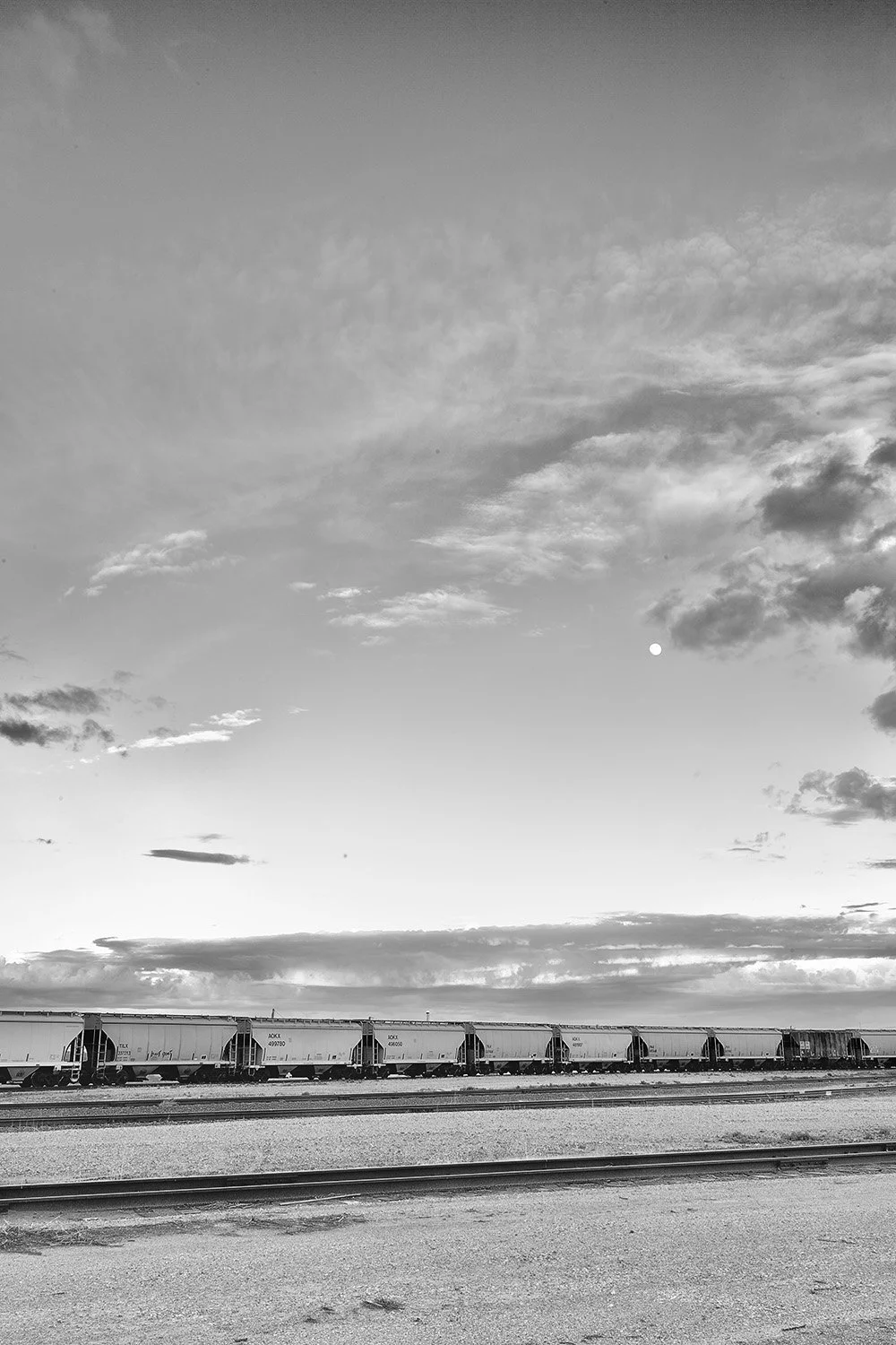 Ten Hopper Cars, Moon, and Clouds