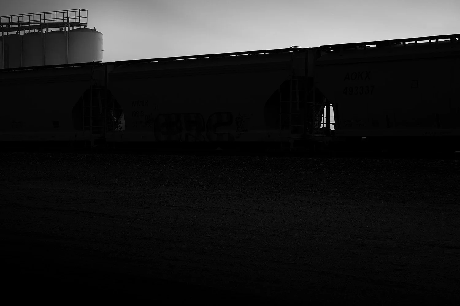 Three Cars, Four Tanks, and Shadows