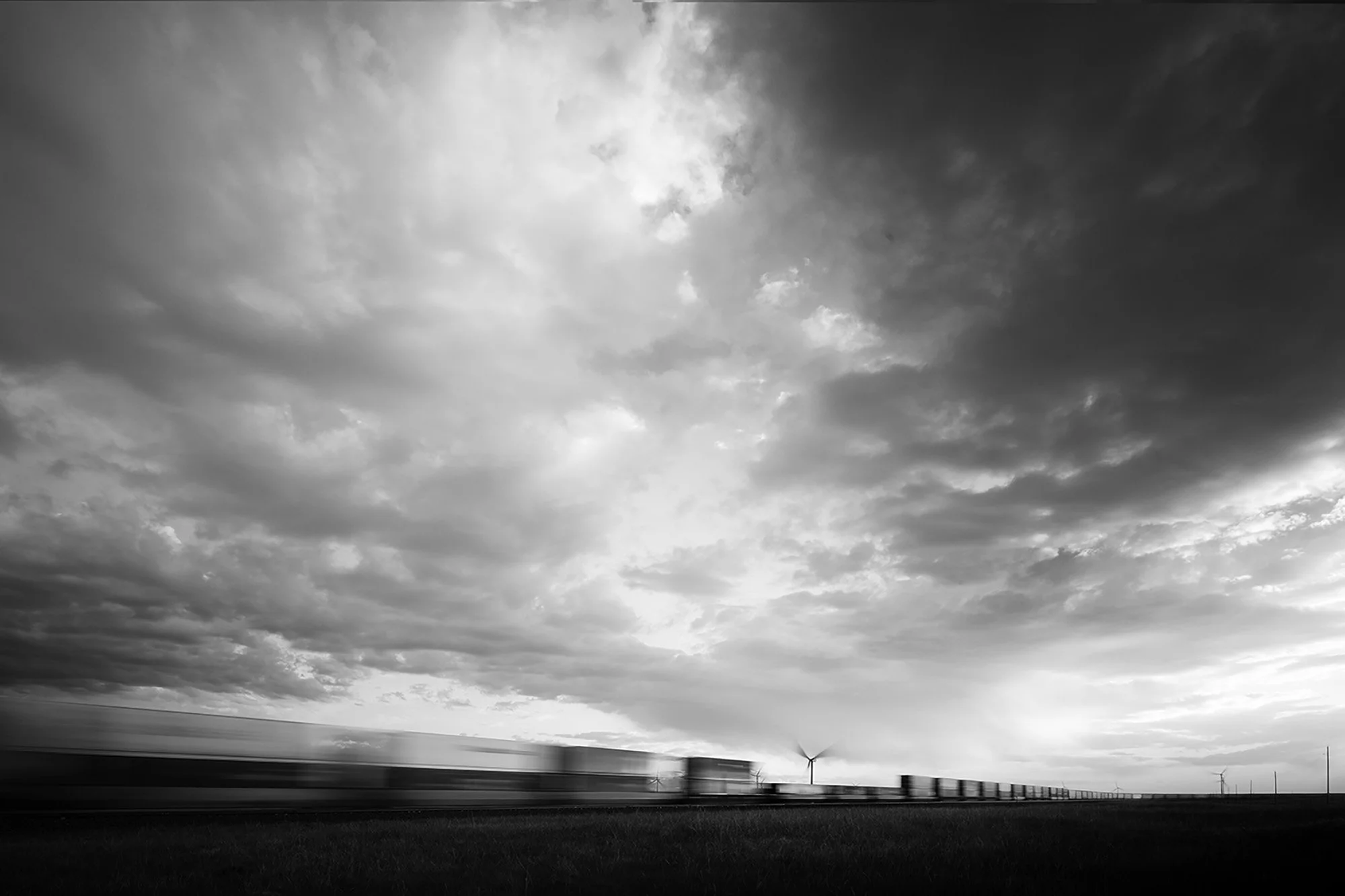 Windmills And Passing Train