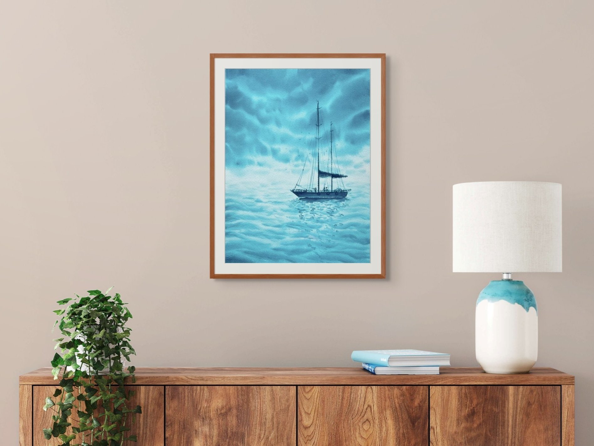 Turquoise Dreams is an Original Watercolor Painting. It is a monochromatic turquoise blue painting with wooden frame on a shelf with white lamp.