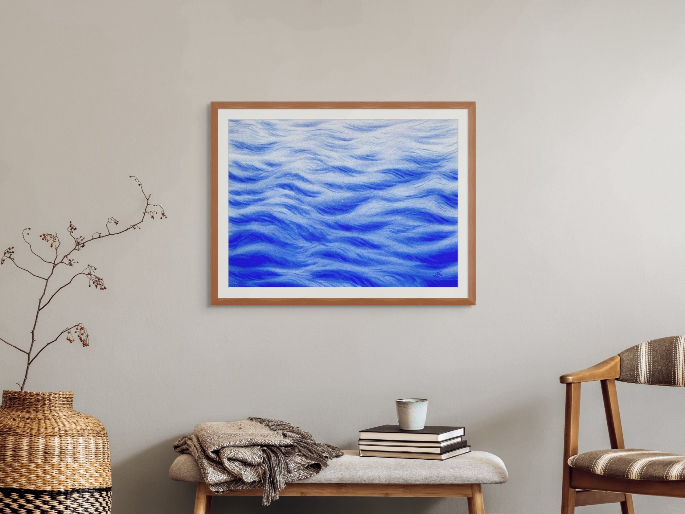Original watercolor painting "A Touch of Wind" framed and staged in a living room, adding a refreshing, airy vibe with its soft waves and light accents.