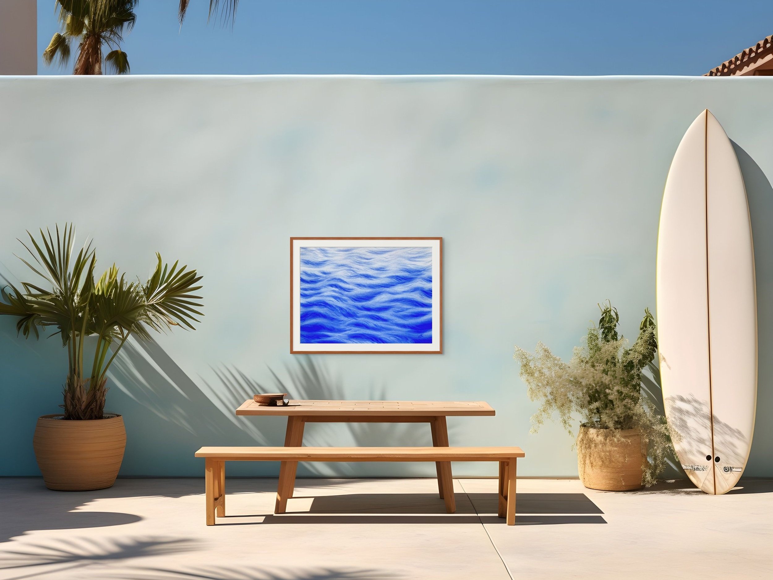 Original watercolor painting "A Touch of Wind" framed and staged in a patio area, adding a refreshing, airy vibe with its soft waves and light accents.