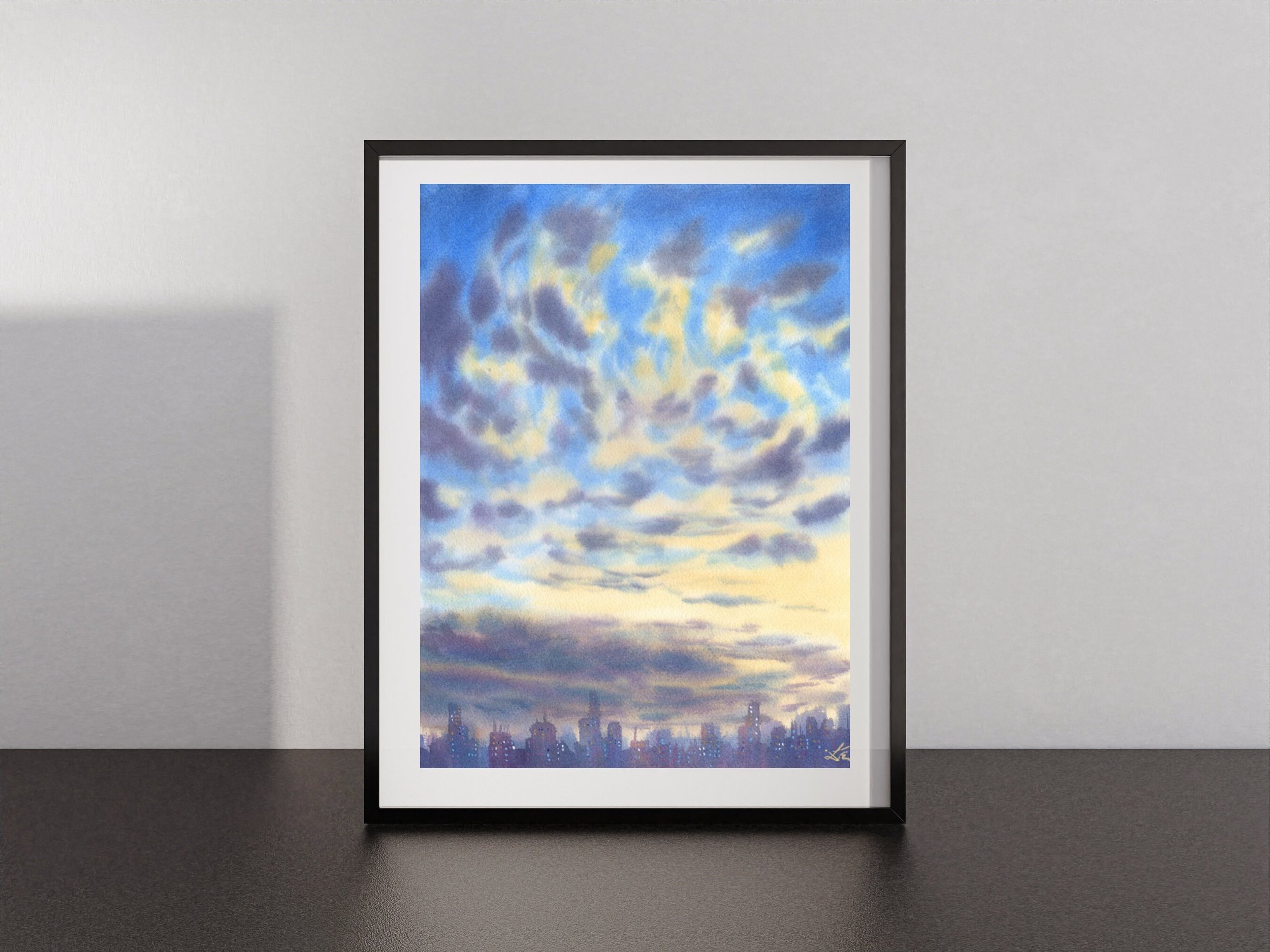 Cotton Clouds is a Giclée Fine Art Print that Captures the Magic of Sunrise and Sunset in the City framed on a shelf