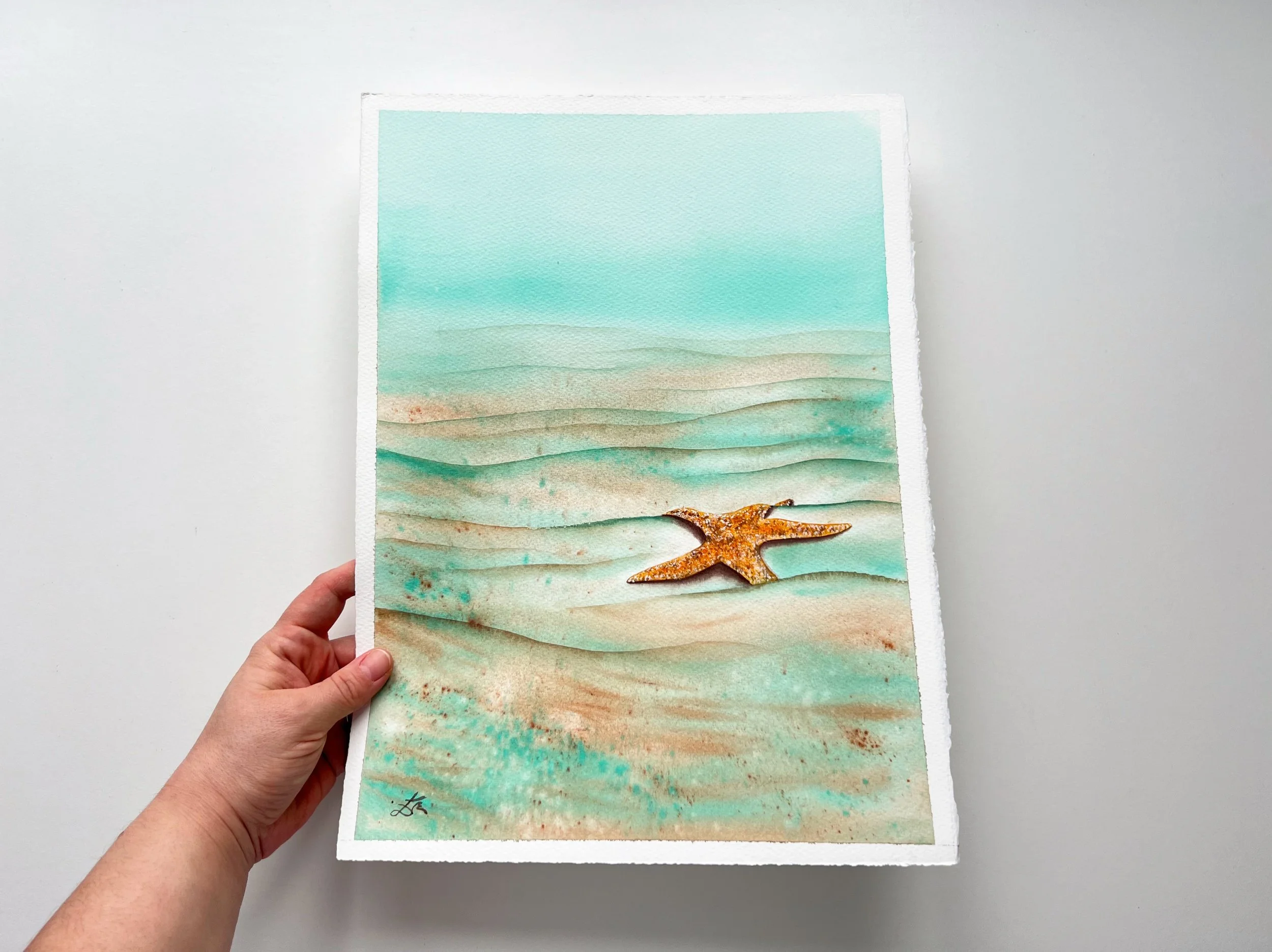 Close up from Starfish Watercolor Painting in my hand. This is underwater Marine life art for kids or adults who love vibrant art.
