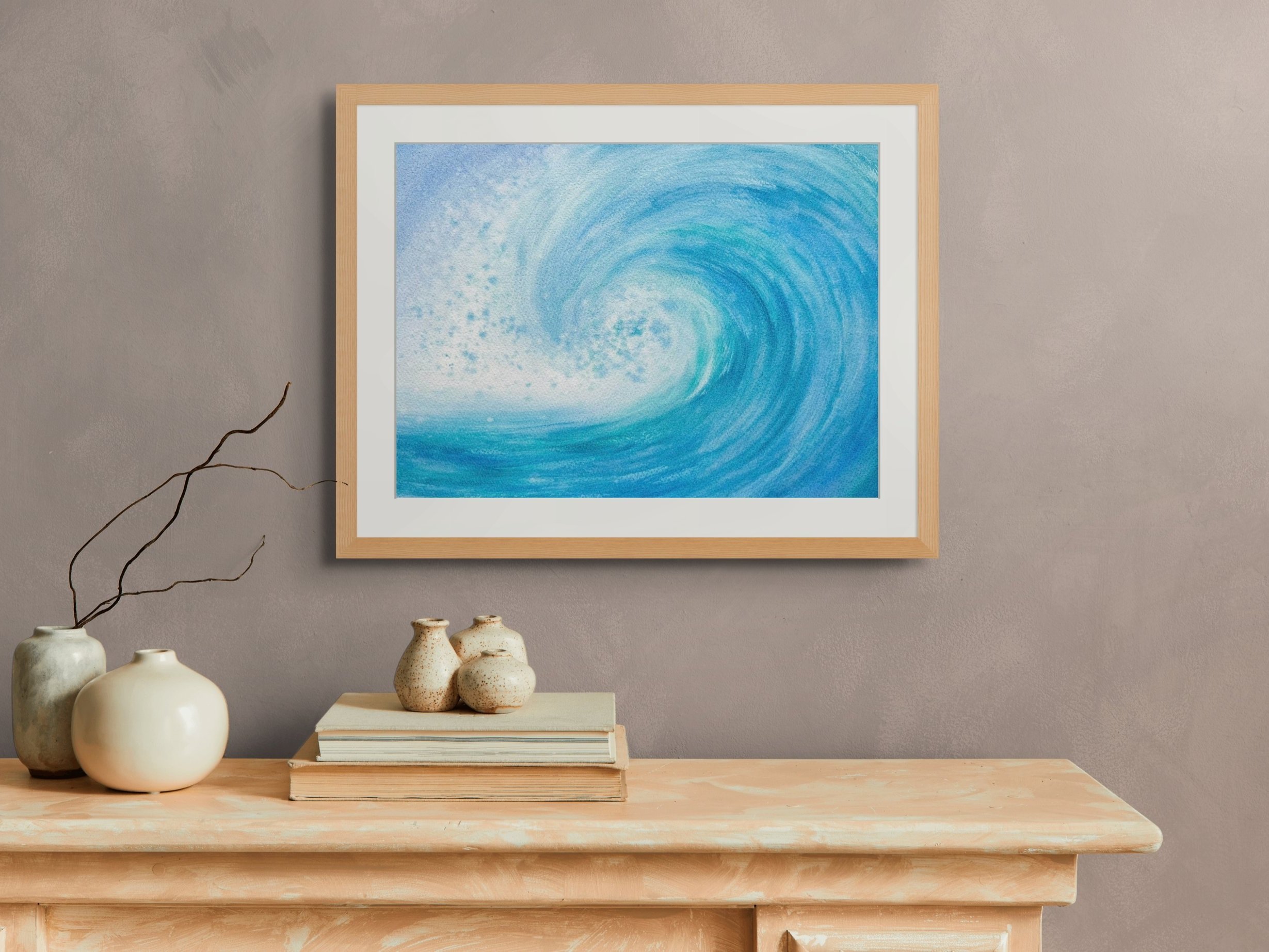 A room set up of "Time for Surfing" original watercolor painting that captures the thrill and energy of the sea. A dynamic painting of a powerful wave, perfect for ocean lovers.