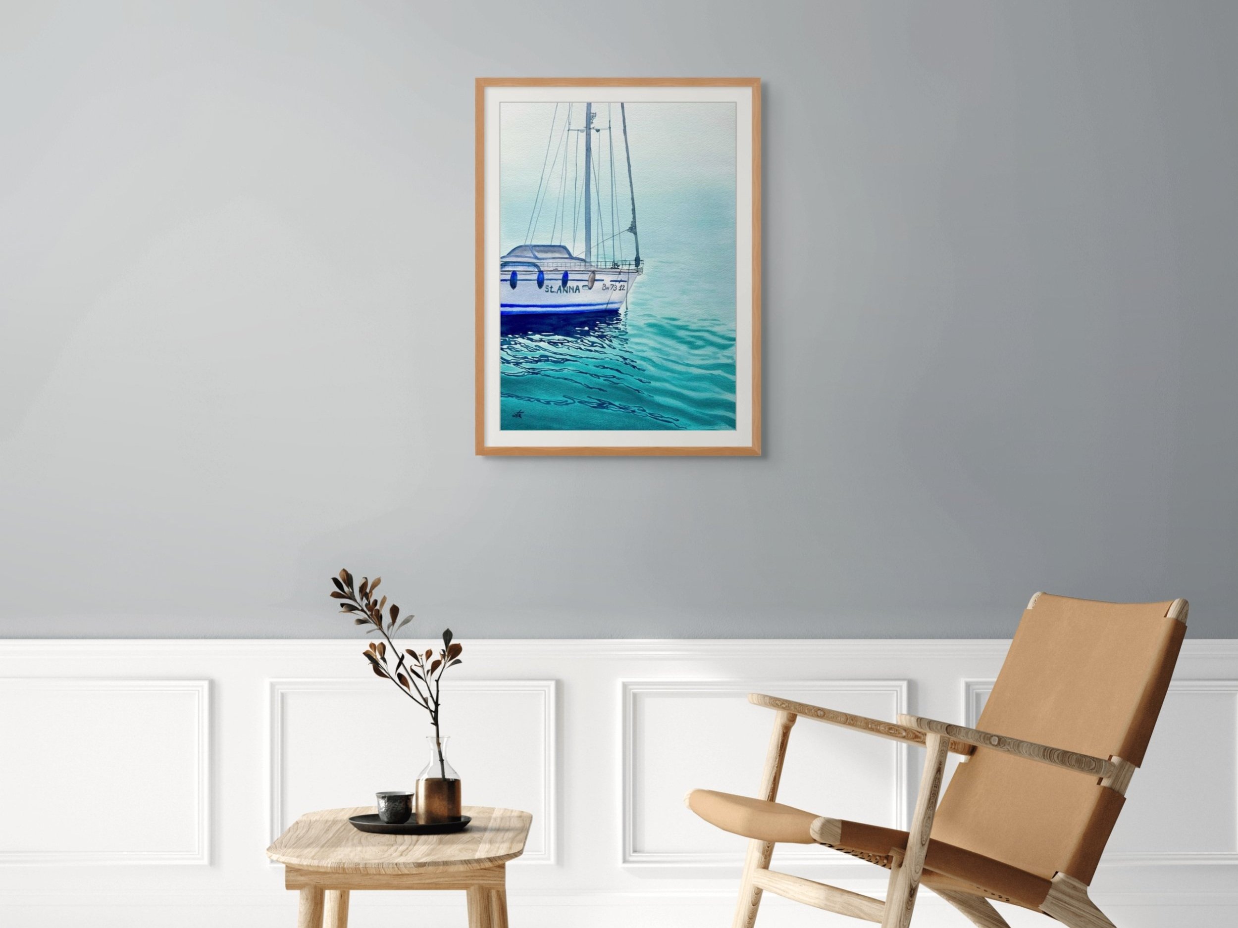 Original watercolor painting "St. Anna" framed and staged in a cozy living room. Nautical decor with peaceful maritime vibes.