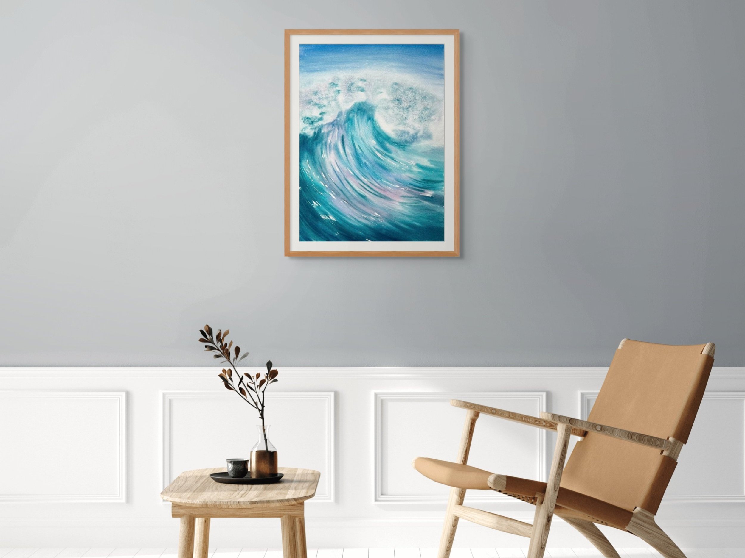 Splash of Colour is an original watercolor celebrating the ocean's untamed power in bold blues, pinks, and purples create dynamic energy. Displayed in a living room.