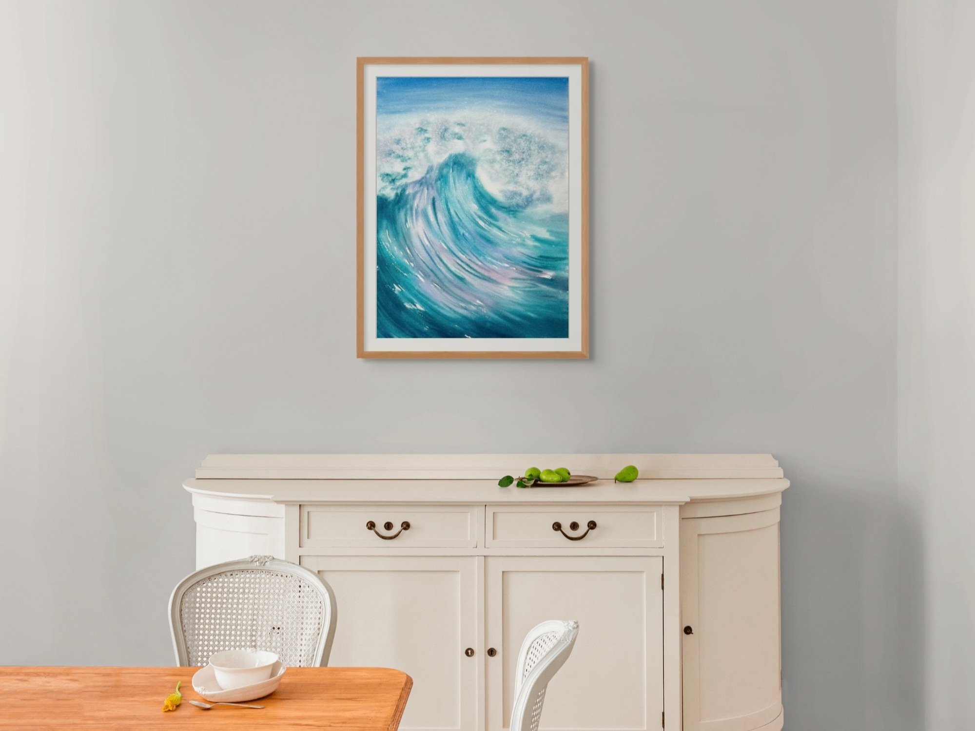 Splash of Colour is an original watercolor celebrating the ocean's untamed power in bold blues, pinks, and purples create dynamic energy. Displayed in a living room.