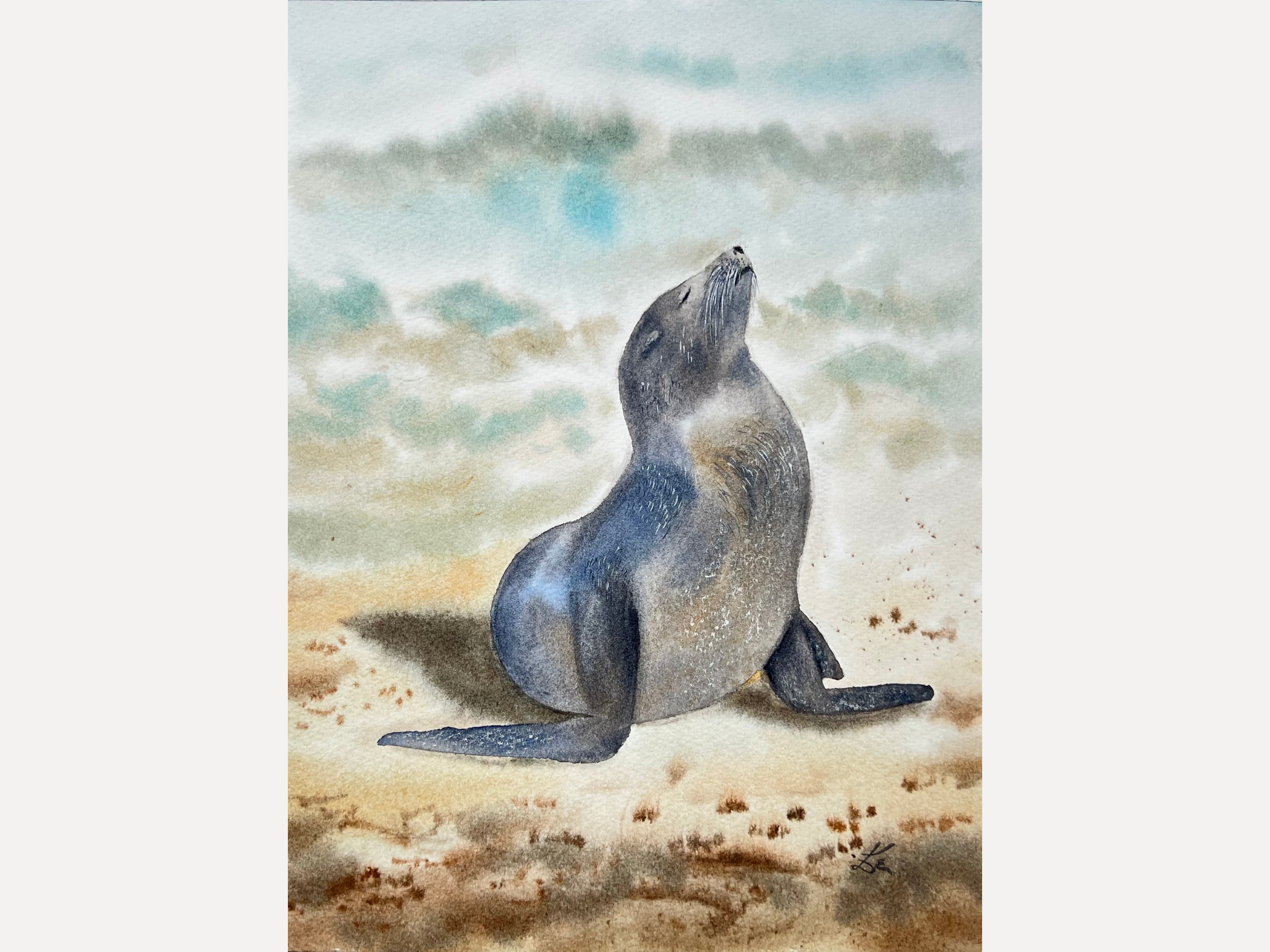 This original watercolor features a gentle Sunbathing Seal on the beach, painted in impressionistic style.