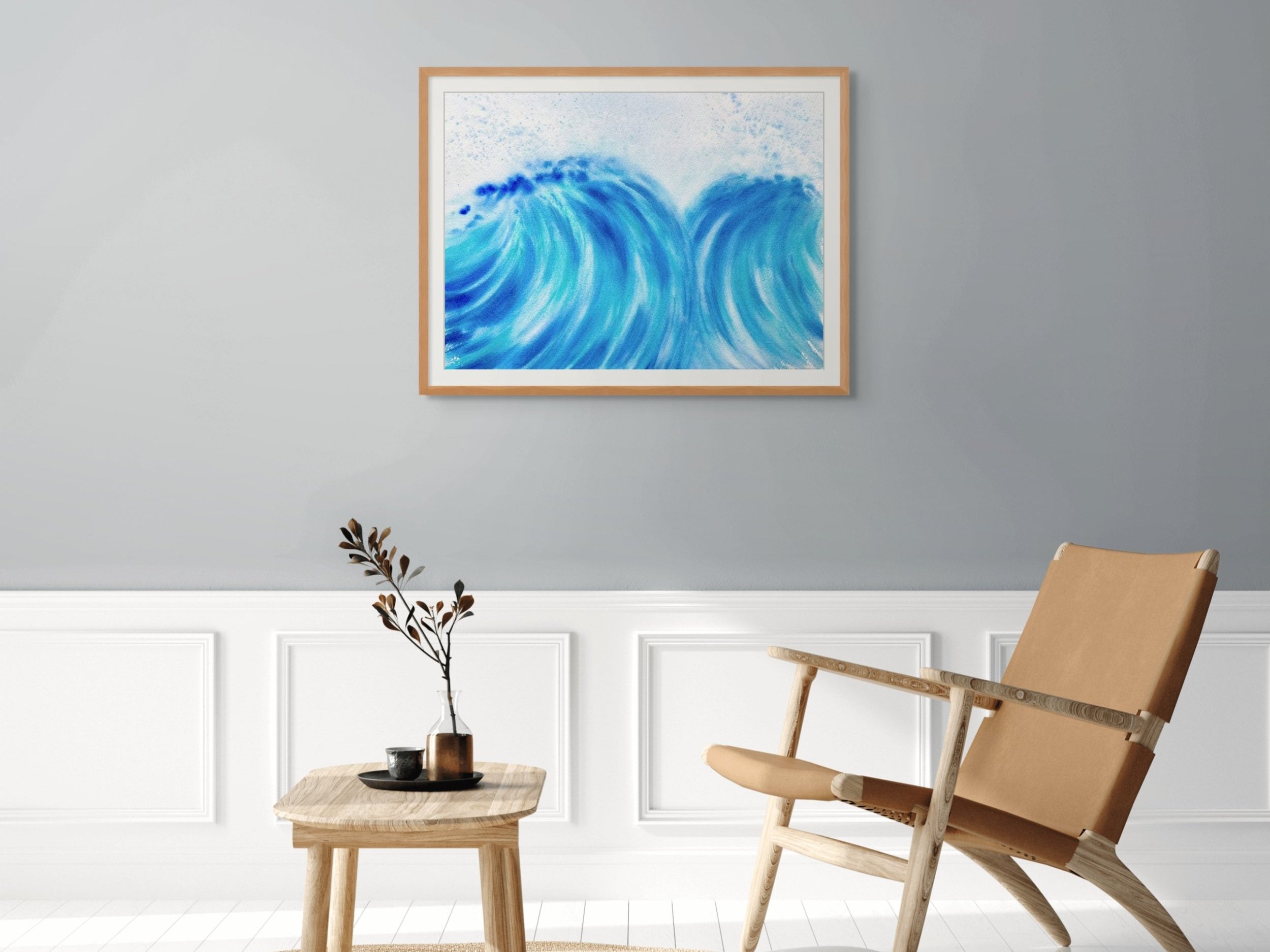 The vibrant watercolor painting "A Dance for Two" featuring dynamic crashing waves in a living room set up. Perfect for modern coastal decor.
