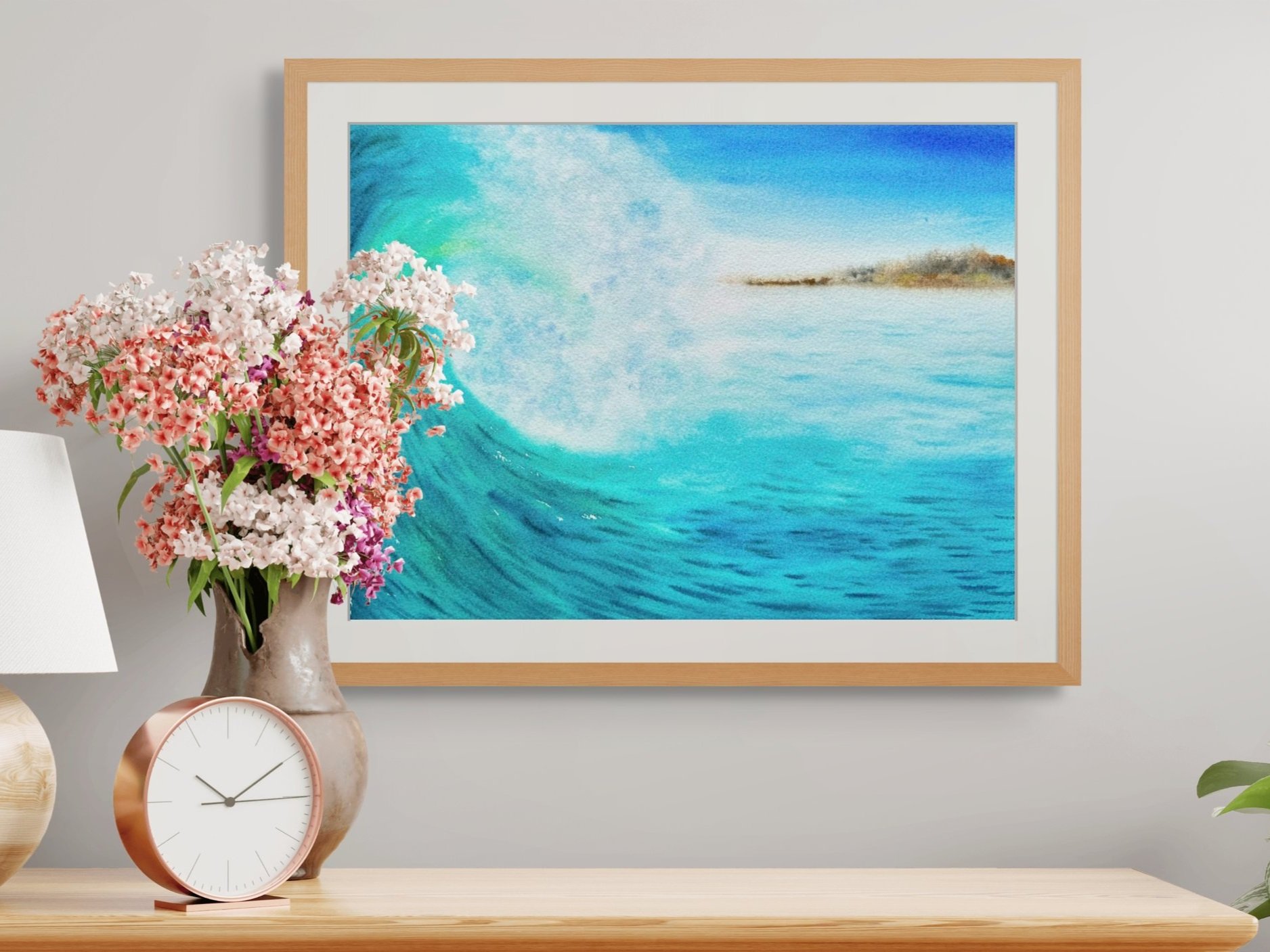 Turquoise blue crashing wave painting, framed and hanging in a bright hallway. An ocean-inspired artwork adding dynamic energy to your home.